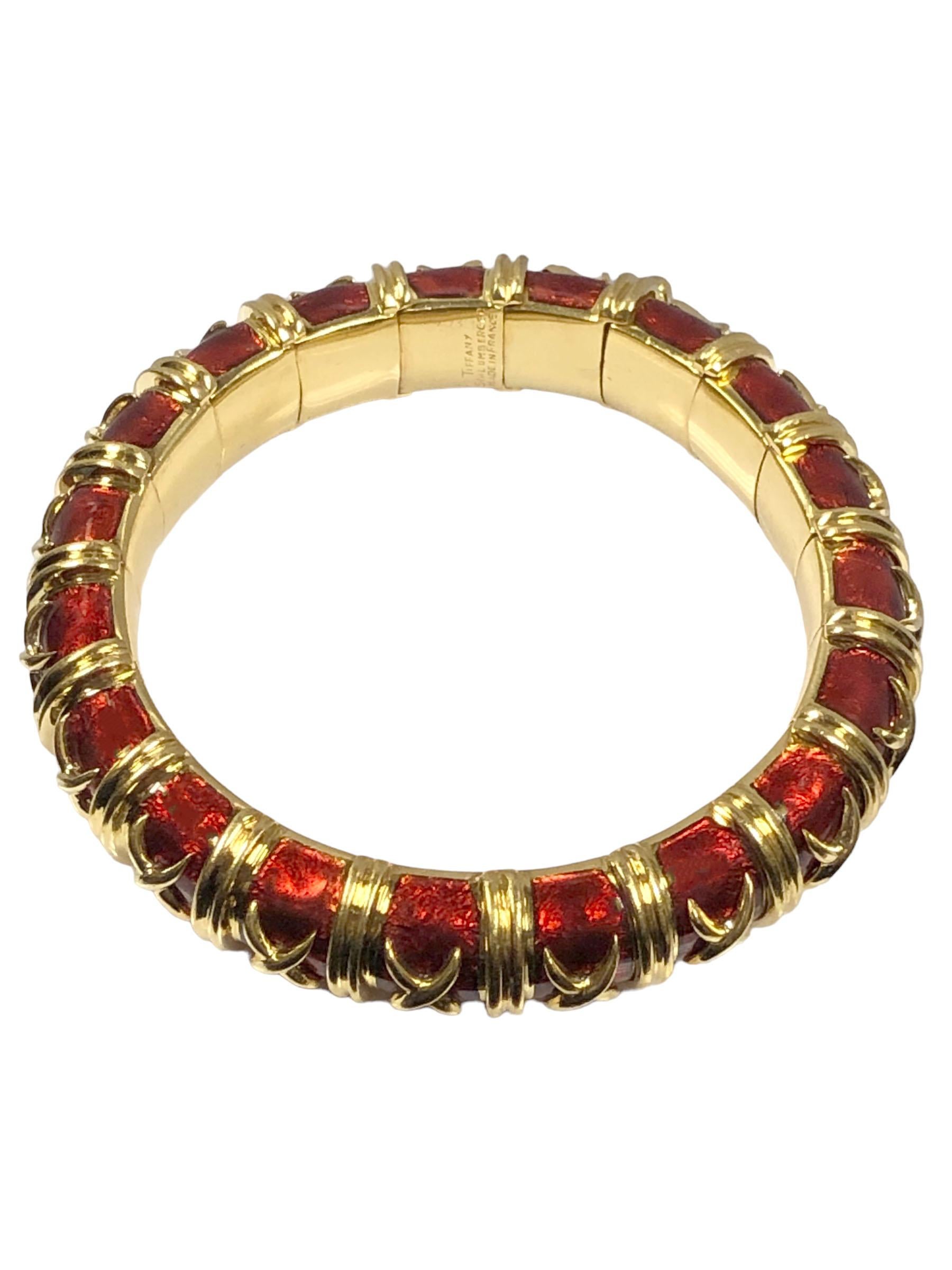 Circa 1990 Jean Schlumberger for Tiffany & Co. Croisillon collection 18k Yellow Gold hinged Bracelet, finished in the more Desirable Red Guilloche Enamel with applied X decorations, measuring 1/2 inch wide with an inside measurement of 6 1/2 inches