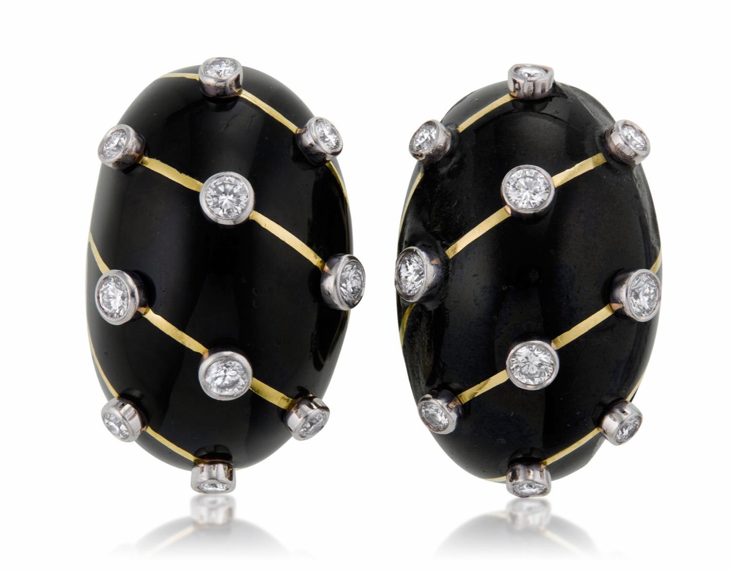 Tiffany & Co. Jean Schlumberger Diamond and Black Enamel Earrings.
This pair of earrings has 20 round with approximate total weight of 1.00 - 1.10 carats, black enamel, 18k yellow gold and platinum, signed Tiffany & Co., Schlumberger Std.,