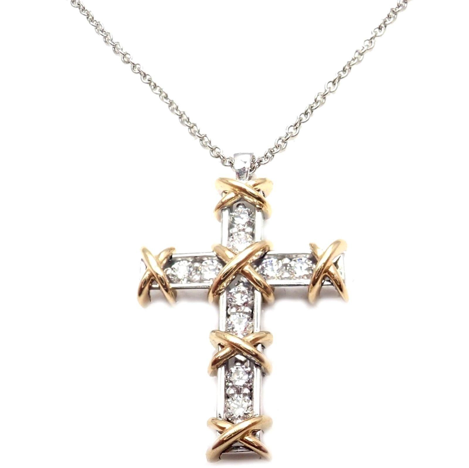 Platinum & 18k Yellow Gold Diamond Cross Pendant Necklace by Jean Schlumberger for Tiffany & Co. 
With 10 round brilliant cut diamonds VVS1 clarity, G color total weight approx. .35ct
Details: 
Length: 18.5