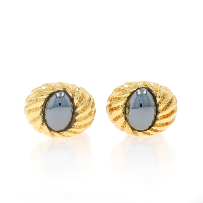 Brand: Tiffany & Co.
Designer: Jean Schlumberger

Metal Content: 18k Yellow Gold

Stone Information

Natural Hematite
Cut: Oval Cabochon
Color: Grey

Style: Cufflinks
Features: Ribbed Detailing

Measurements

Tall: 9/16