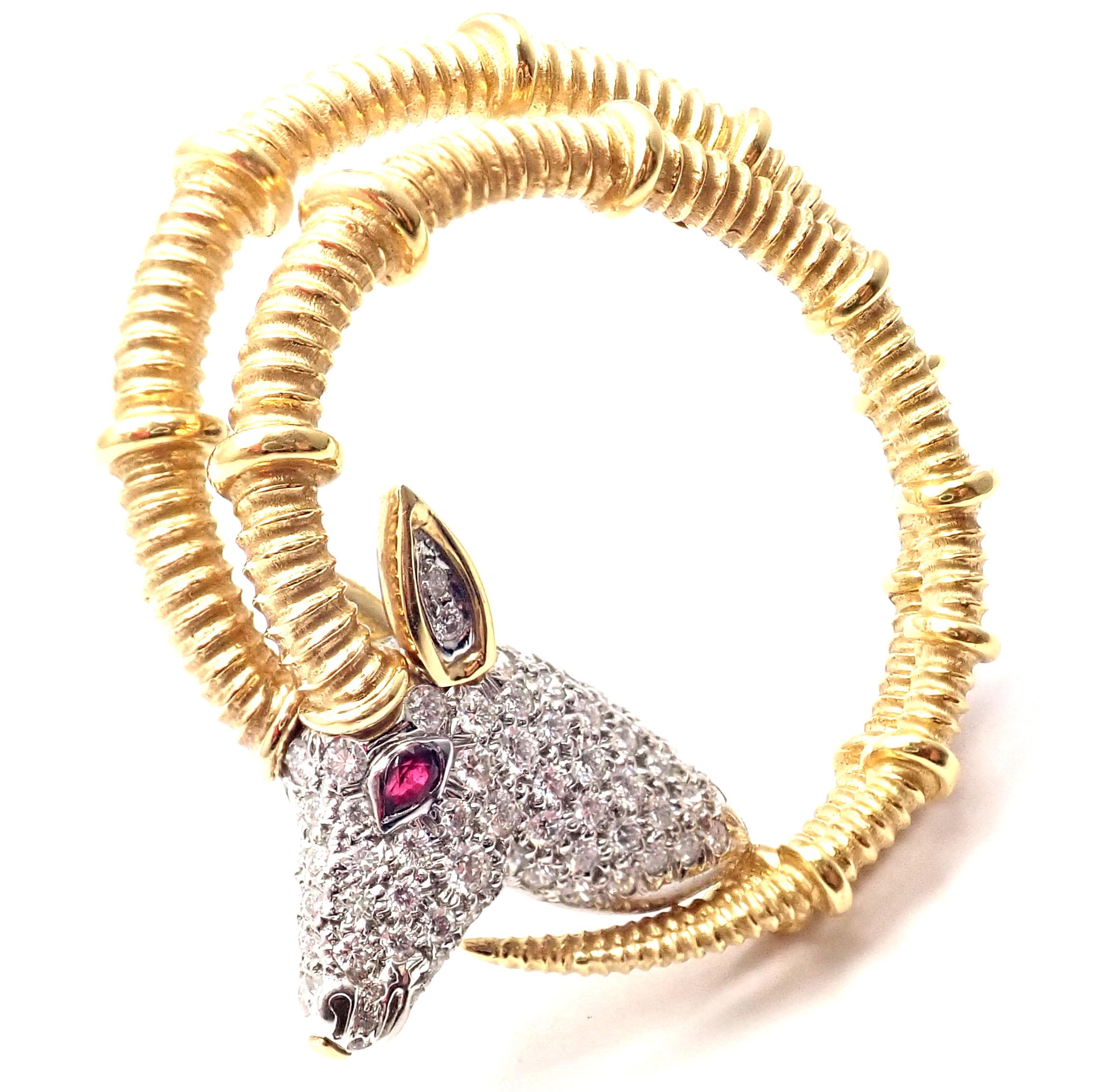 18k Yellow Gold and Platinum Diamond Ruby Ibex Pin Brooch by Jean Schlumberger for Tiffany & Co. 
With Round brilliant cut diamonds VVS1 clarity, E color 
total weight approx. 1.20ct  
1 ruby
Details:  
Weight: 24.1 grams 
Measurements: 1.63