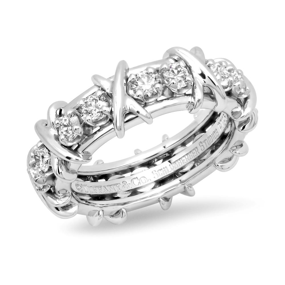 TIFFANY & Co. Jean Schlumberger Platinum Sixteen Stone Diamond X Ring 6.5

Jean Schlumberger’s visionary creations are among the world’s most intricate designs. Brilliant diamonds alternate with platinum X's to create this dazzling design.

Metal: