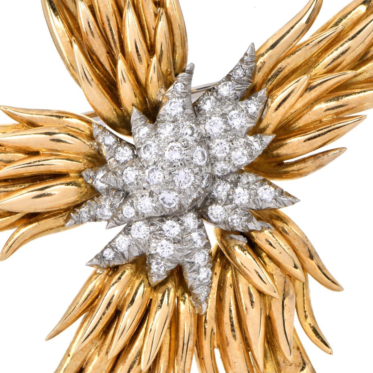 An iconic creation by legendary designer Jean Schlumberger, this French Flames brooch, crafted in 18K yellow gold and platinum, bursts outward in sweeping, flame-like forms, culminating in a dramatic center of round brilliant diamonds that offer