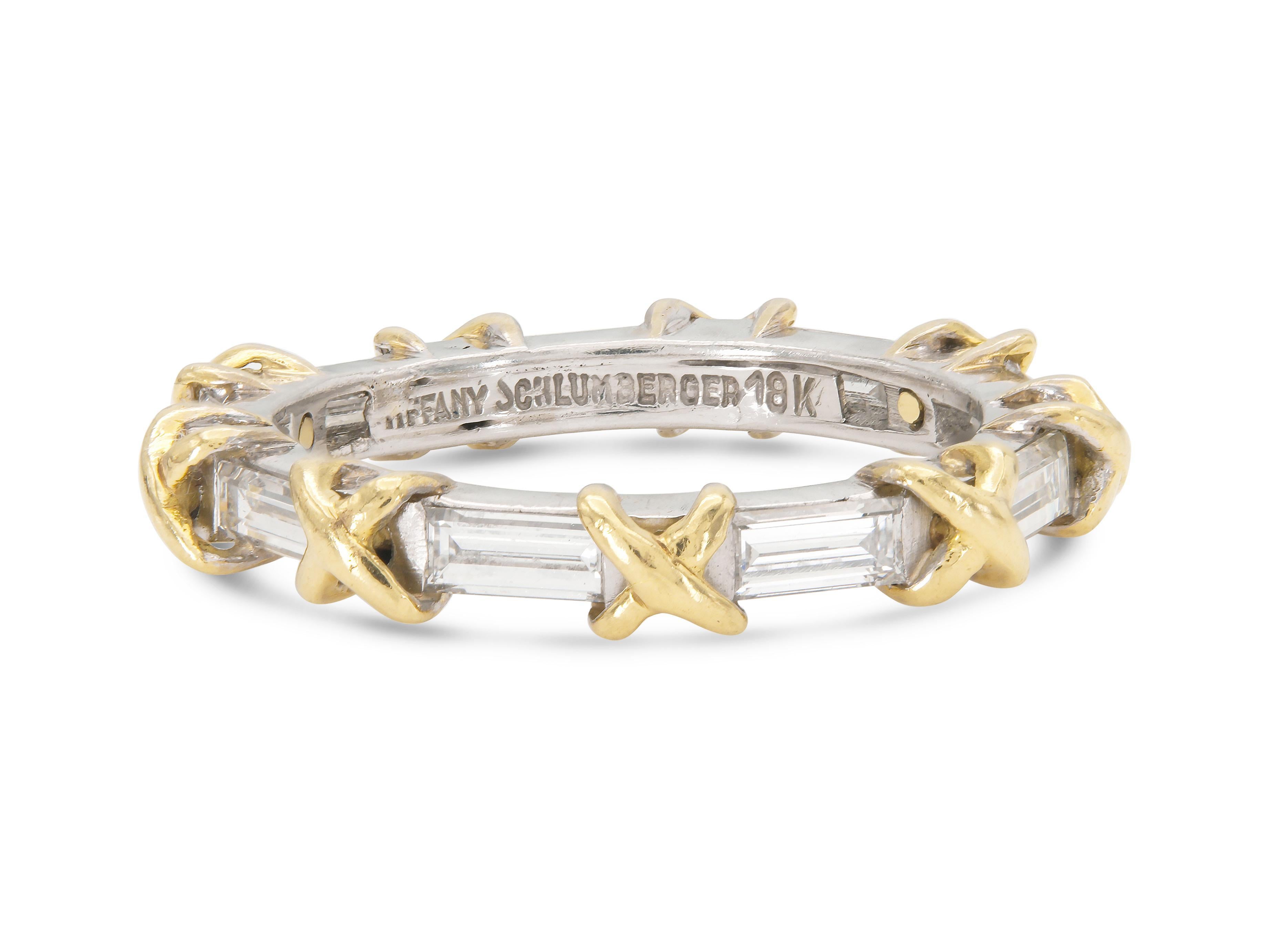 Finely crafted in 18k white and yellow gold with 9 Baguette cut Diamonds weighing approximately a total of 1.50 carats.
Signed by Jean Schlumberger for Tiffany & Co.
Size 6
