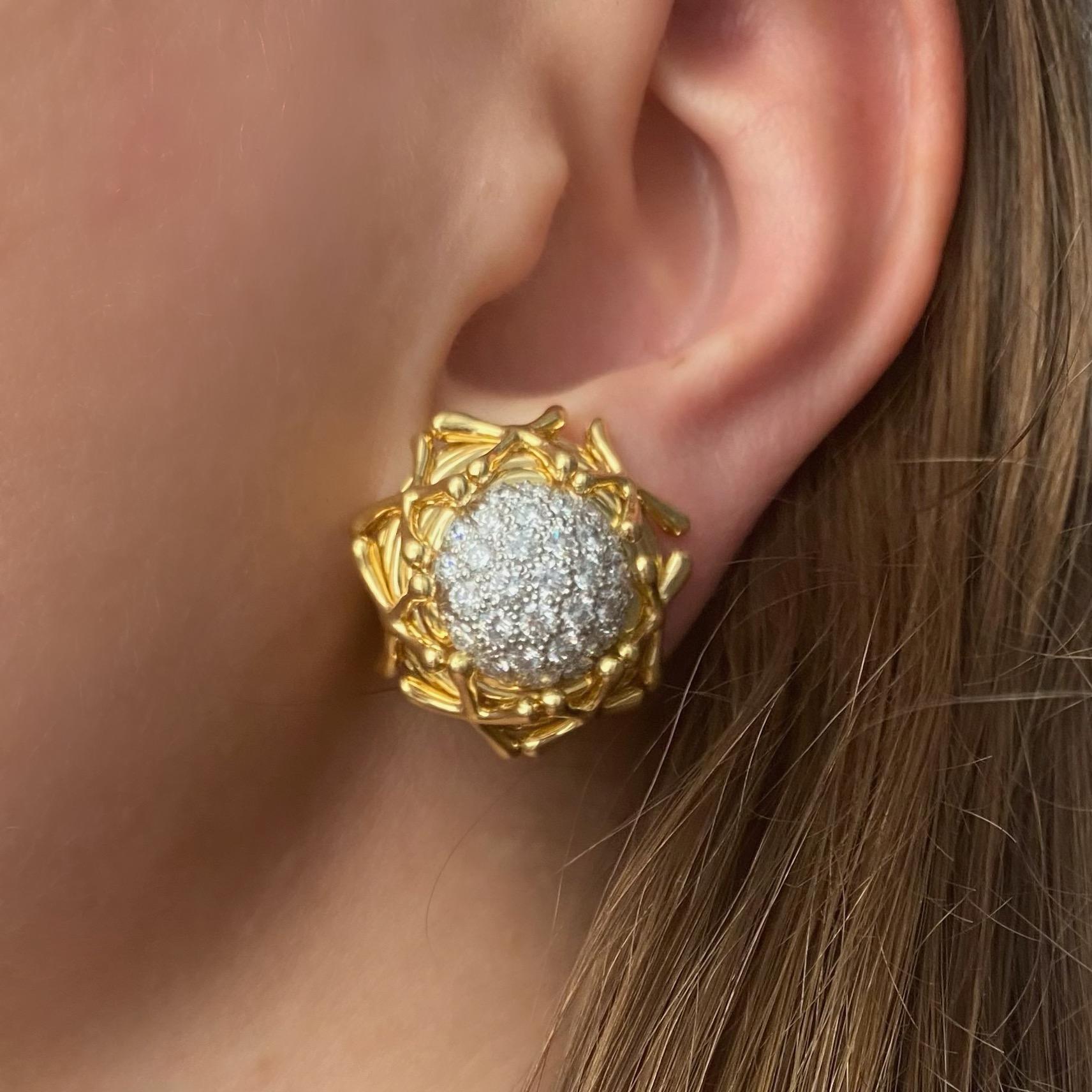 Tiffany & Co. Jean Shlumberger diamond clip on earrings in 18k yellow gold. These impressive earrings have platinum centers pave set with total of 62 round brilliant cut diamonds with weight of approximately 3.5 carats color F-G, clarity VS.