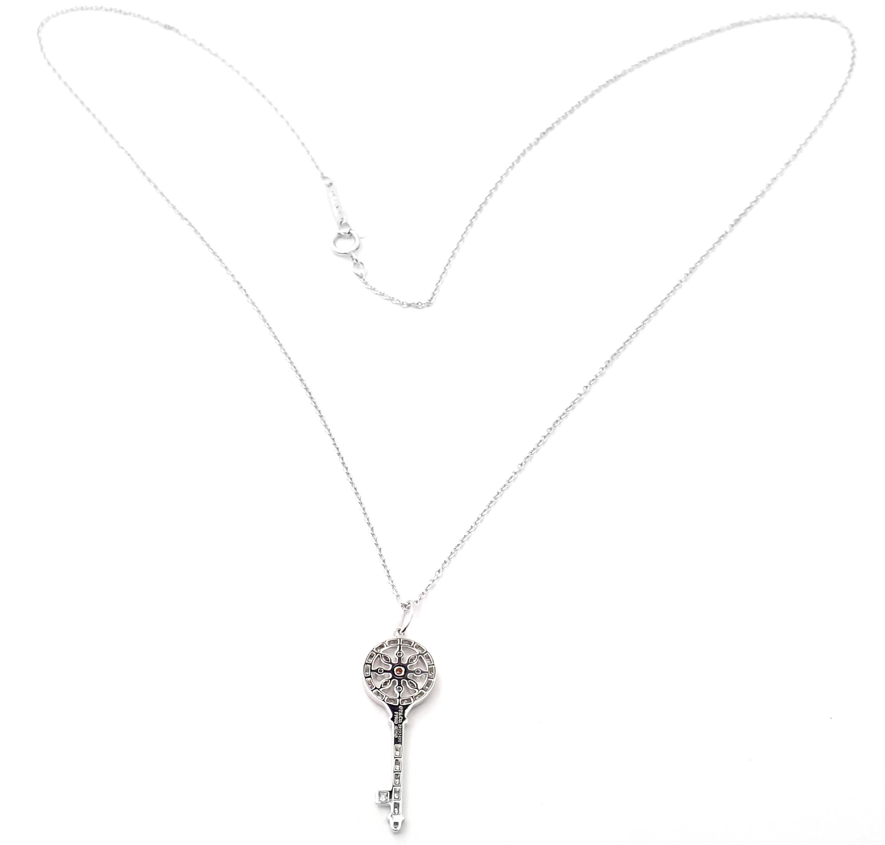 Platinum Fancy Pink And White Diamond Kaleidoscope Key Pendant Necklace by Tiffany & Co.
With Round brilliant cut white and fancy pink diamonds total weigh approximately .10ct
Details:
Key: 1