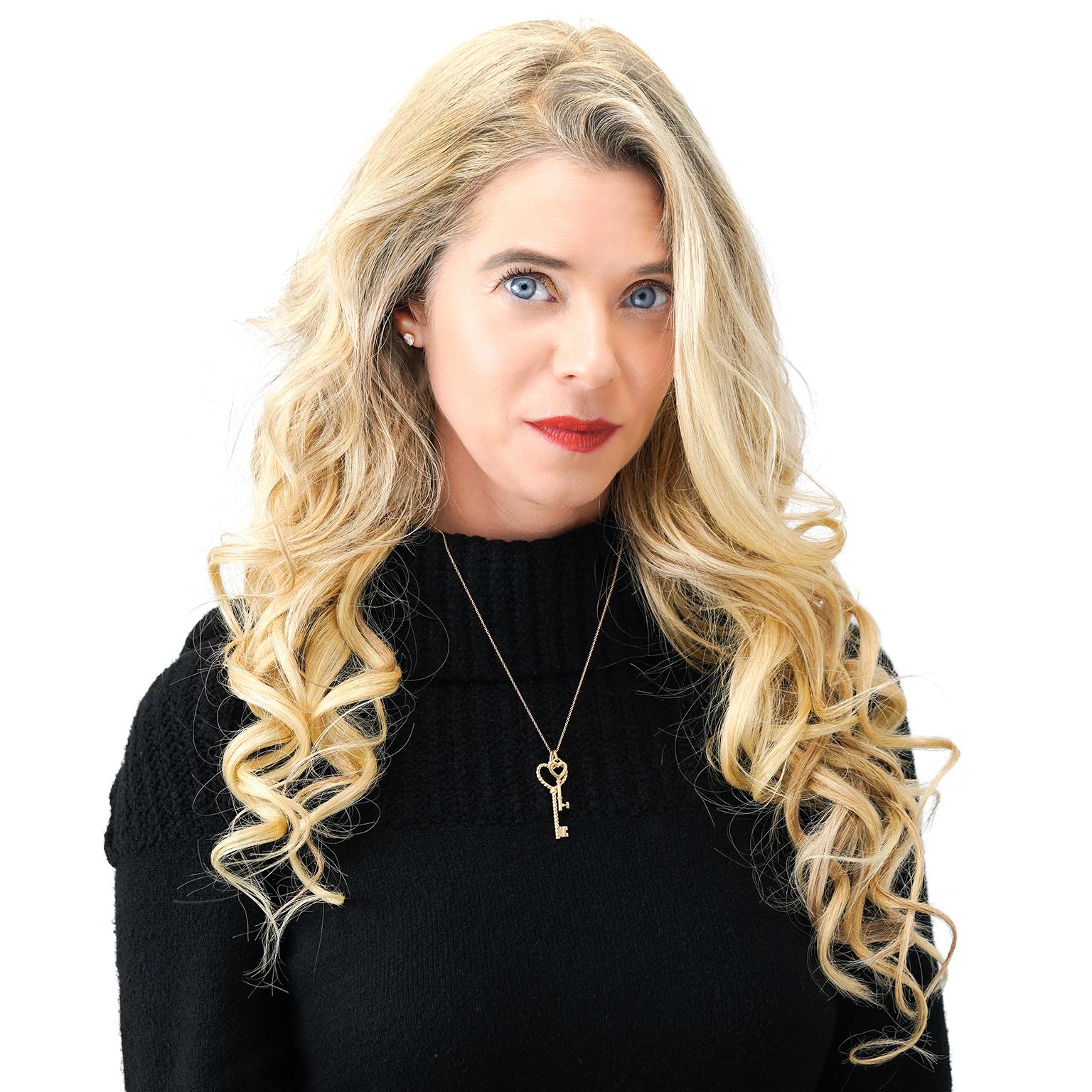 Circa 2000s, 18k, by Tiffany & Co., New York. This 18k yellow gold double key pendant features iconic heart and cable twist motifs. The Tiffany key collection was introduced in 2009 and features keys inspired by archival designs dating back to the