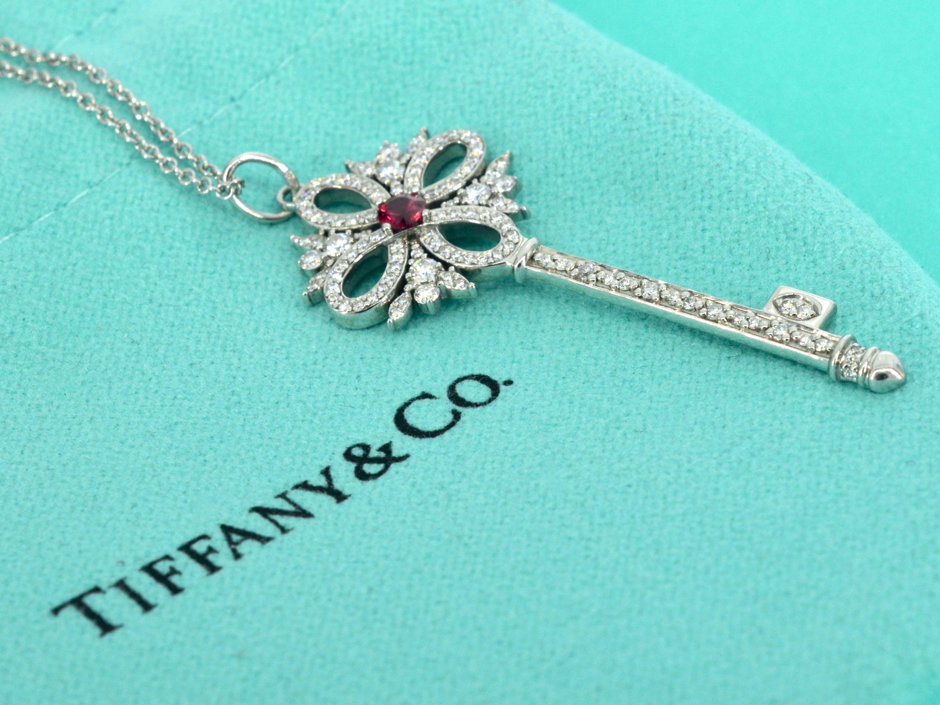 A captivating Tiffany & Co necklace from the Tiffany Keys collection, featuring the exquisite Victoria Key Pendant. This stunning necklace, showcases a brilliant-cut diamond of 0.26 carats, boasting the exceptional brilliance of original T&CO