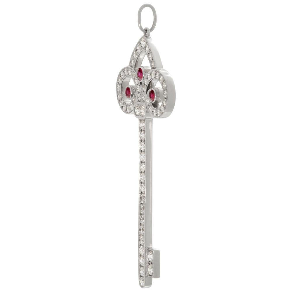 Tiffany & Co. Keys Tiffany Fleur de Lis Key Pendant in platinum with approx 0.77 cts in diamonds & approx 0.13 cts in rubies. Measures 2 inches.