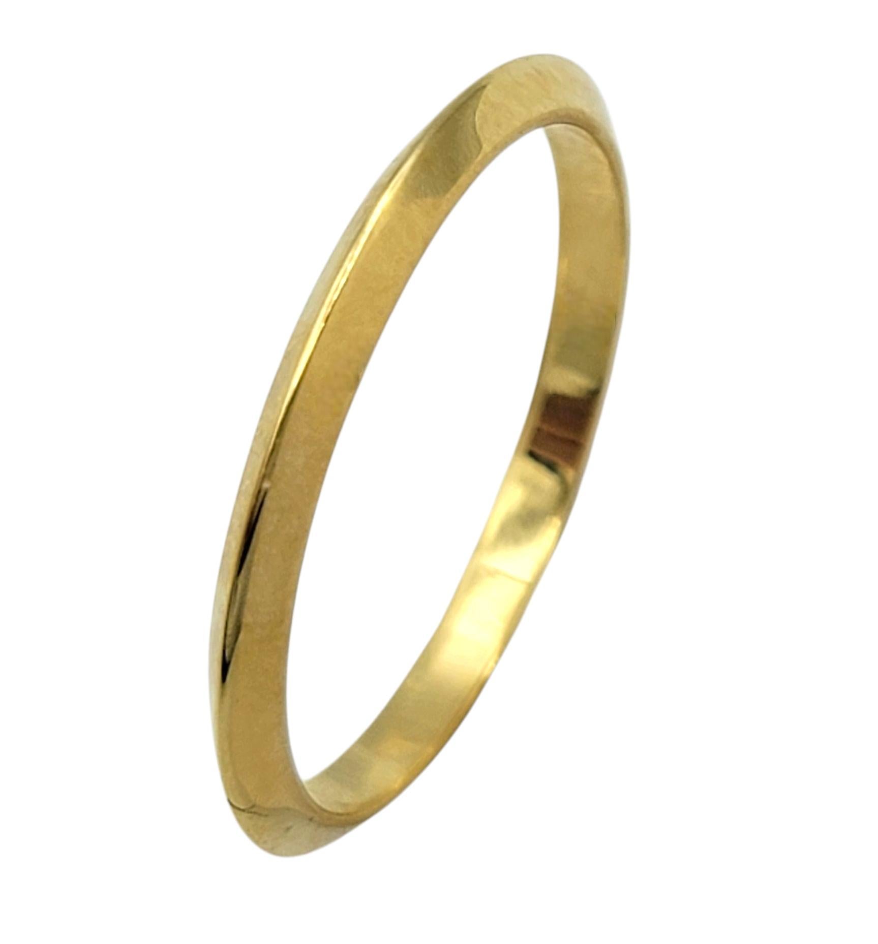 Ring Size: 6.5

A true classic from Tiffany & Co., this knife edge band ring offers minimalist elegance in its purest form. Crafted in rich 18 karat yellow gold, the slim band features a refined, architectural profile with a subtle ridge that