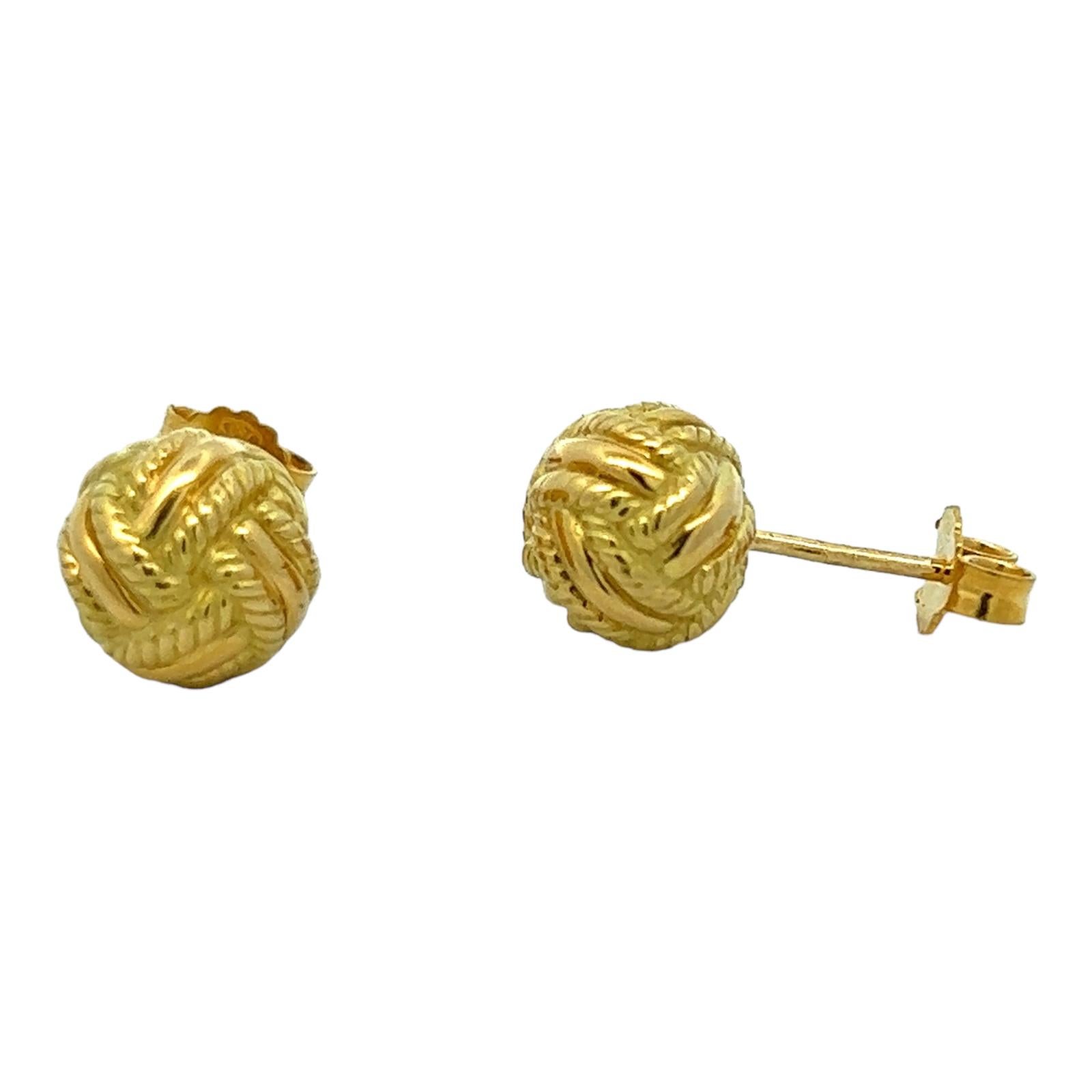 Tiffany & Co. Knot Ball stud earrings crafted in 18 karat yellow gold. The earrings measure 9.5mm in diameter, and are stamped T&Co. 750.