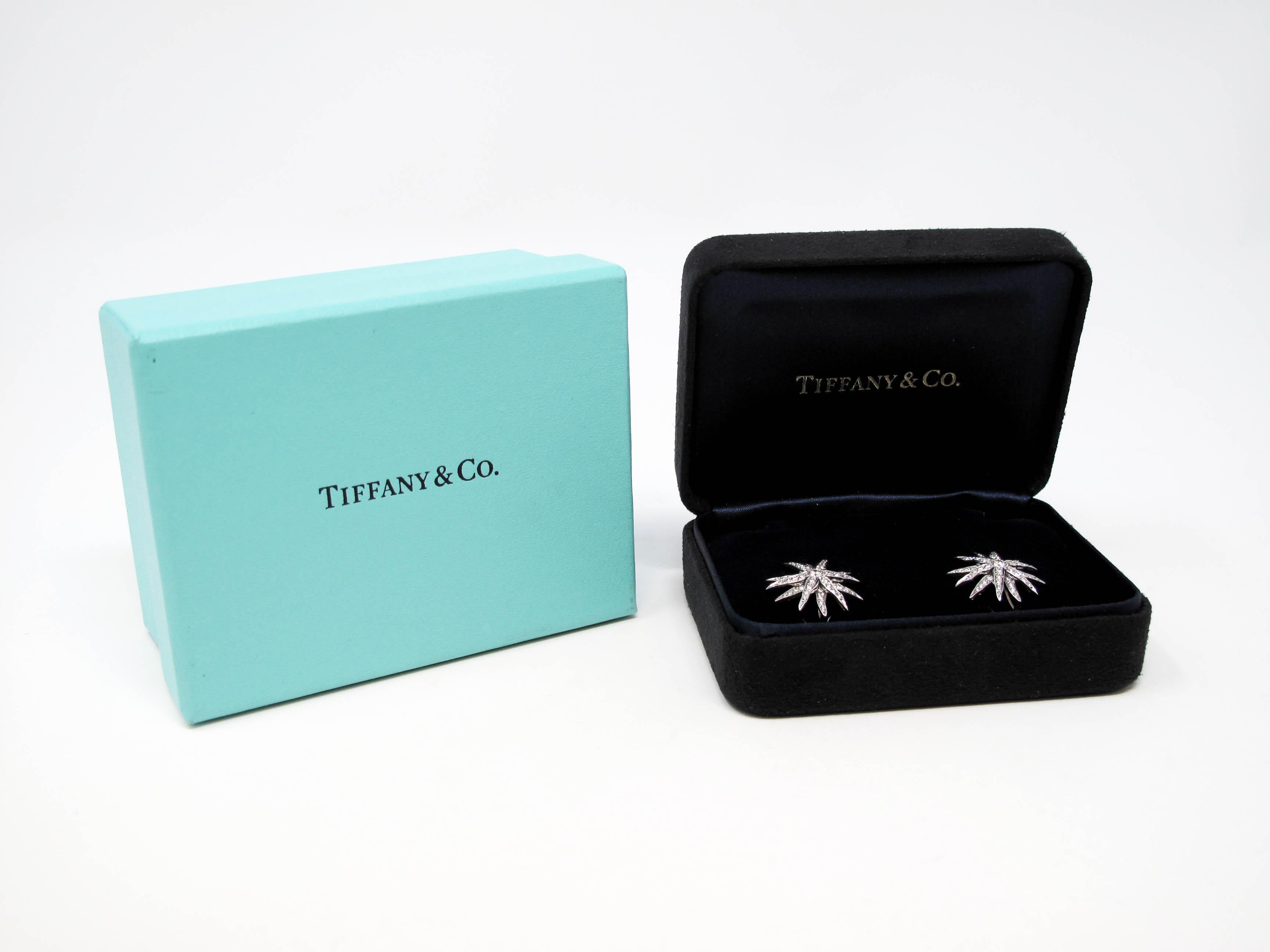 These brilliant diamond earrings are absolutely bursting with sparkle! Part of the Tiffany & Co. Lace Collection, these incredible Sunburst earrings feature icy white diamond center stones accented by exploding bursts of glittering pave diamonds.