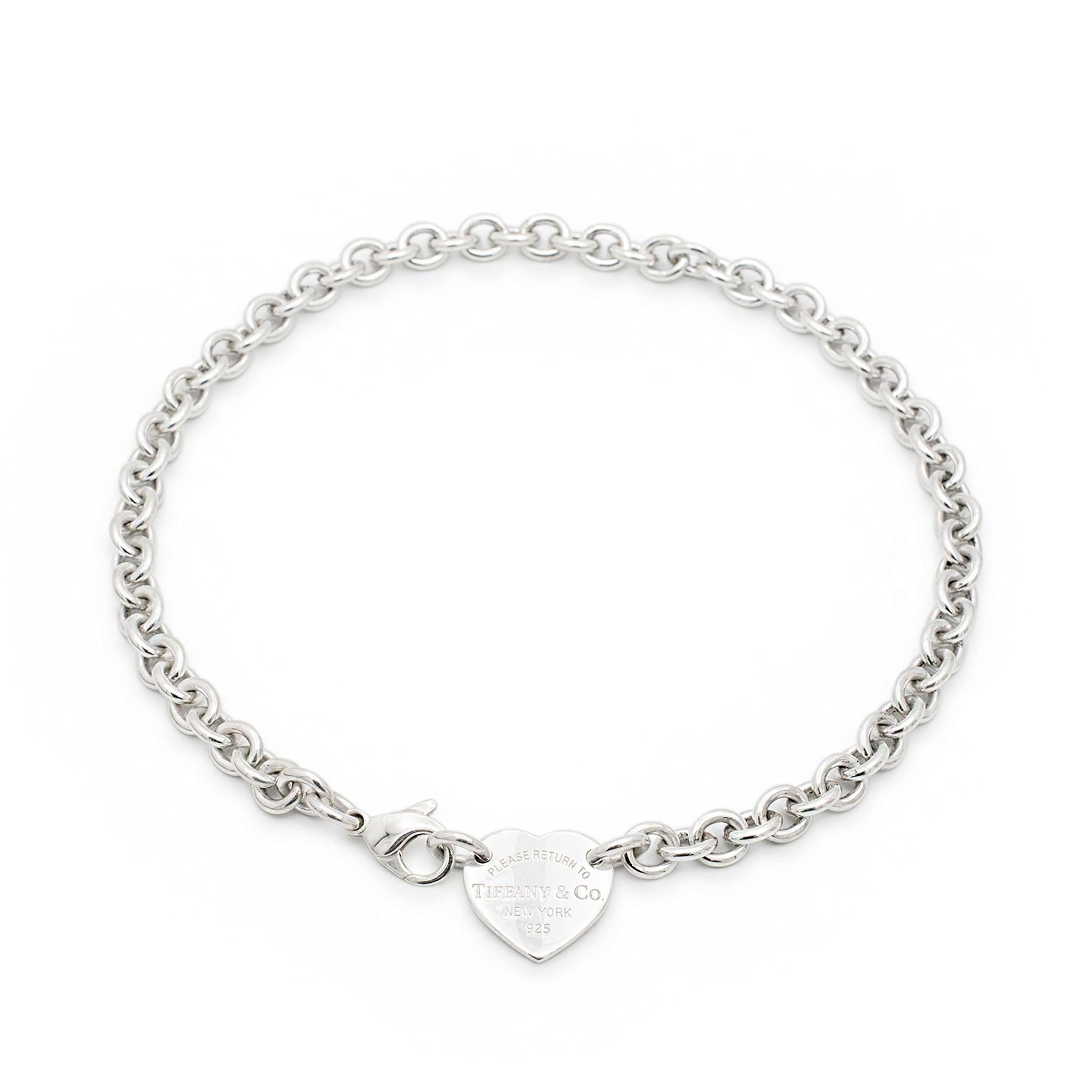 Brand: Tiffany & Co.
Gender: Ladies
Metal Type: 925 Sterling Silver
Length: 15.00 Inches
Chain width: 8.00 mm
Heart Pendant Measurements: 20.00mm x 21.00mm
Weight: 55.00 grams
Ladies silver single strand collar necklace. Engraved with 
