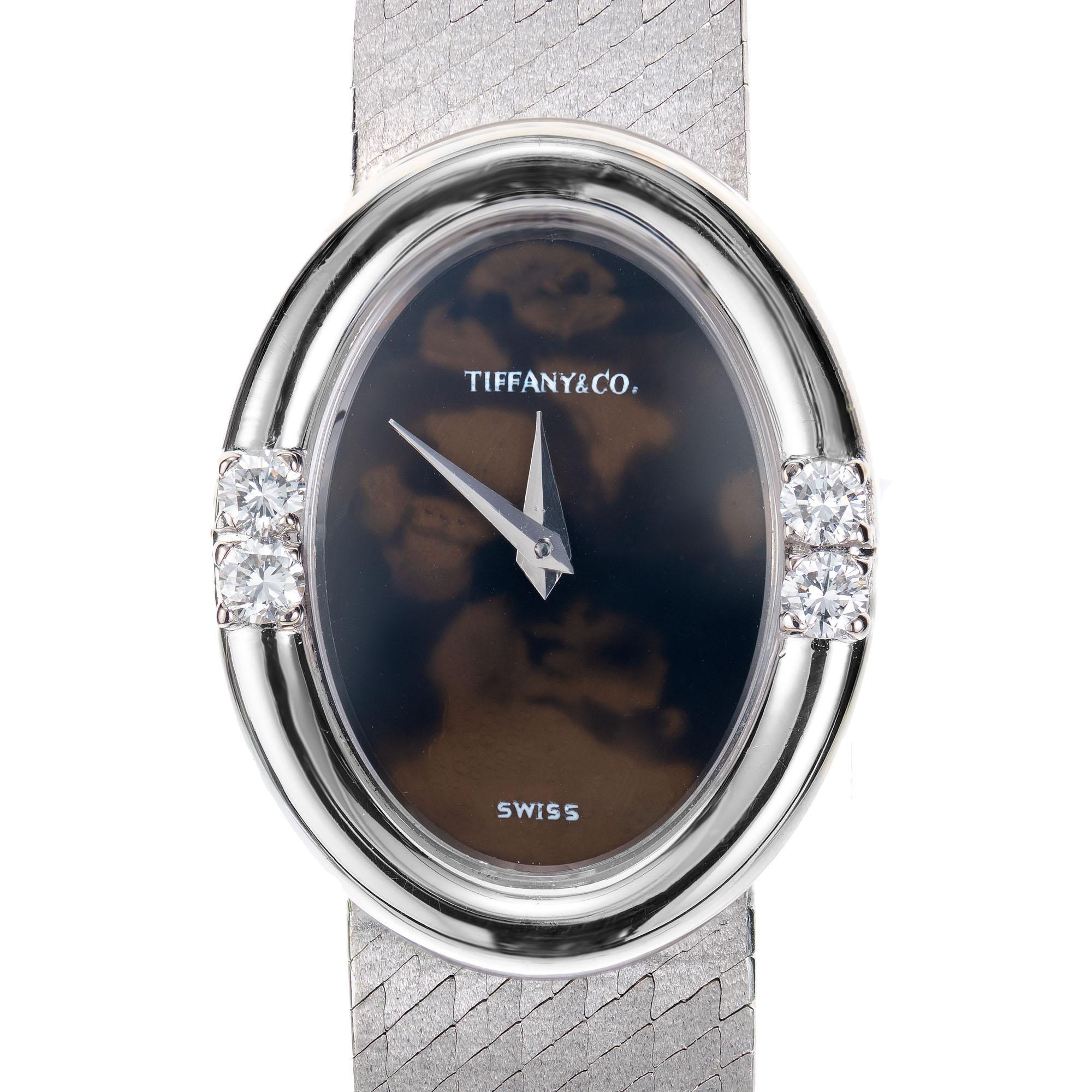 Tiffany & Co. Agate oval dial wristwatch. 18k white gold mesh band. Manual wind and Chopard movement. 7 inches long. 

Case Length: 25.16mm
Case Width: 19.54mm
Band width at case: 12mm
Case thickness: 7.93mm
Band: 18k white gold mesh
Crystal: