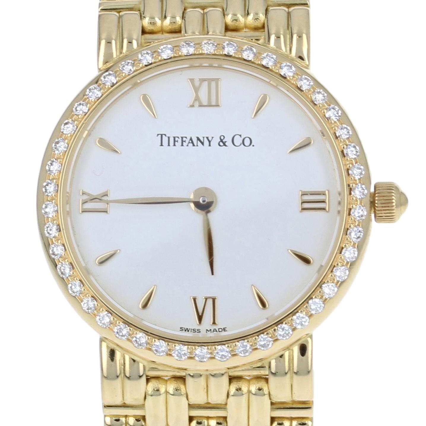 his is an authentic Tiffany & Co. wristwatch. The watch has been professionally serviced and comes with a two-year warranty.

Brand: Tiffany & Co. 
Material: 18k Yellow Gold

Stone Information:
Natural Diamonds  
Clarity: VS1 
Color: F  
Cut: Round