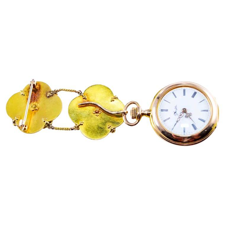 FACTORY / HOUSE: Tiffany & Co.
STYLE / REFERENCE: Art Deco Pendant Watch
METAL / MATERIAL: 18Kt. Yellow Gold and Enamel 
CIRCA / YEAR: 1910
DIMENSIONS / SIZE: 30mm Diameter, 92mm Long with the Chatelain
MOVEMENT / CALIBER: Manual Winding / 17 Jewels