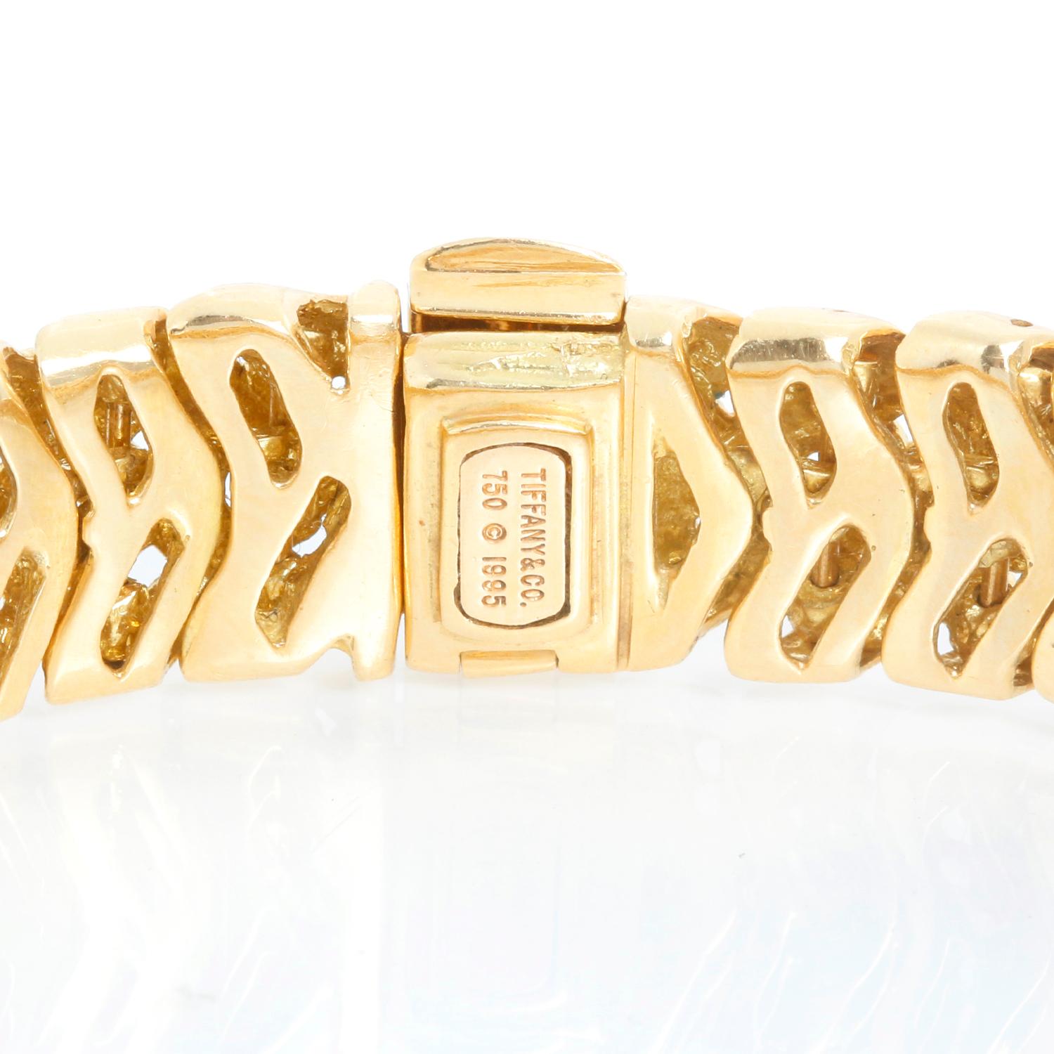 Tiffany & Co. Ladies Vannerie Diamond Bracelet - 18K Yellowy gold lattice diamond bracelet. 36 diamonds weighing a total of approximately 2.00 carats. Diamonds are approximately F-G color and VS2-SI1 clarity. Will fit a 7 1/4 inch wrist. Circa 1995.
