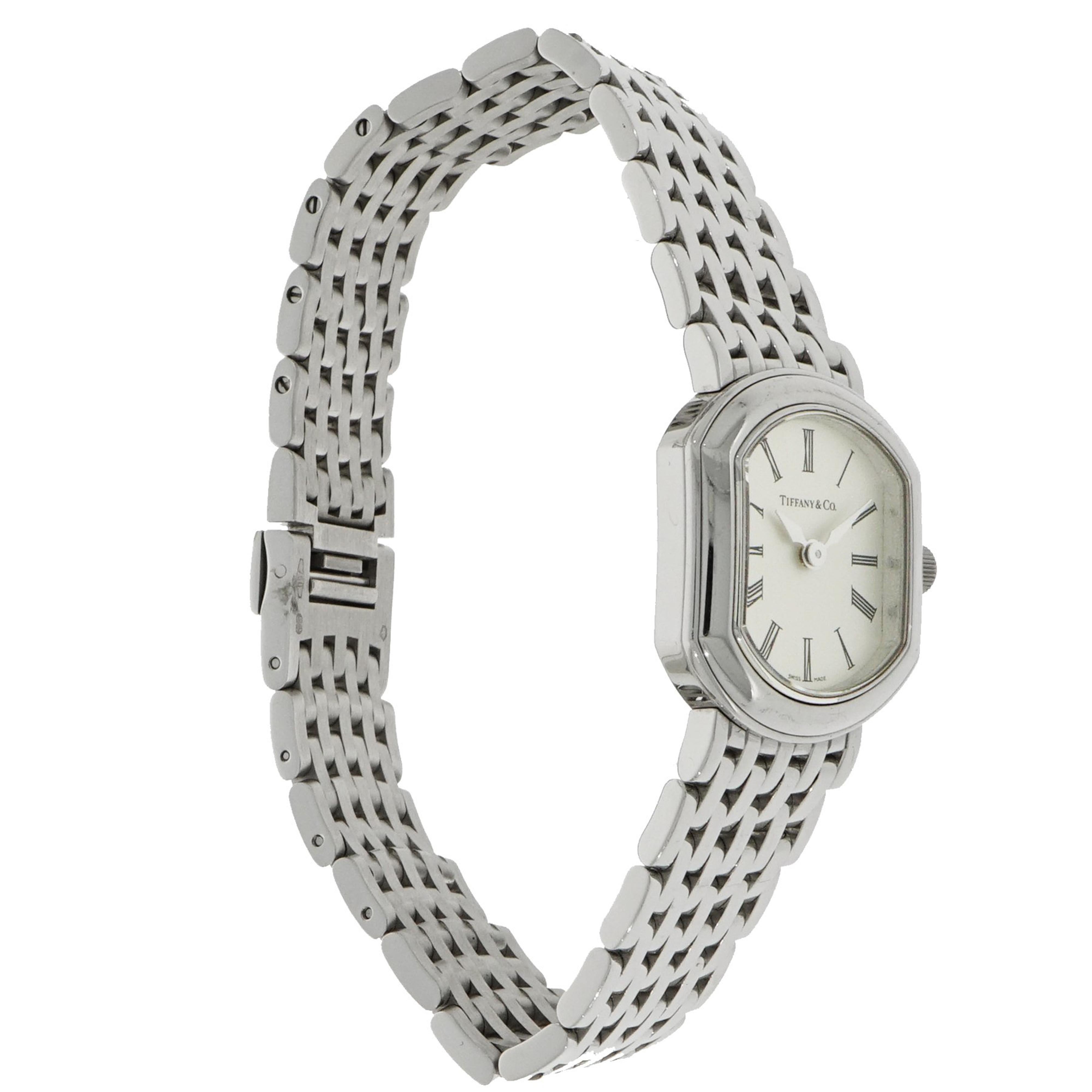 Tiffany & Co. quartz watch crafted in 18K white gold.  This timepiece features a quartz movement with indications for the Hours and Minutes.  The case measures 20.8mm in width and it has a length of 24.5mm and a total thickness of 6mm.  We have the