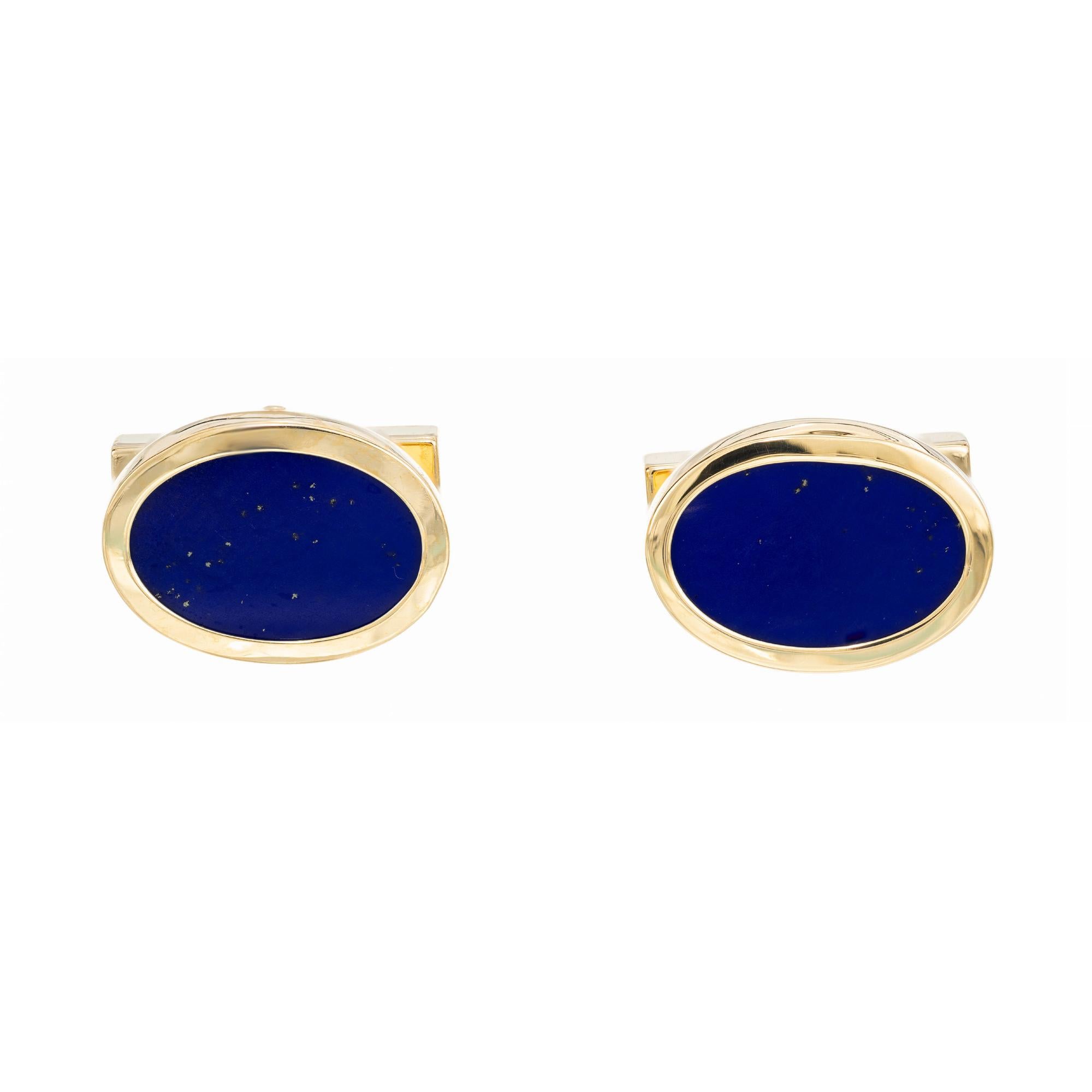 Tiffany & Co Lapis 18k gold cufflinks. Set in 18k yellow gold, 2 rich deep blue oval bezel set Lapis Lazuli. Men's circa 1980's cufflinks. 

2 oval blue lapis lazuli slabs, 15mm x 10mm
18k yellow gold 
Stamped: 18k
Hallmark: Tiffany + Co
14.5