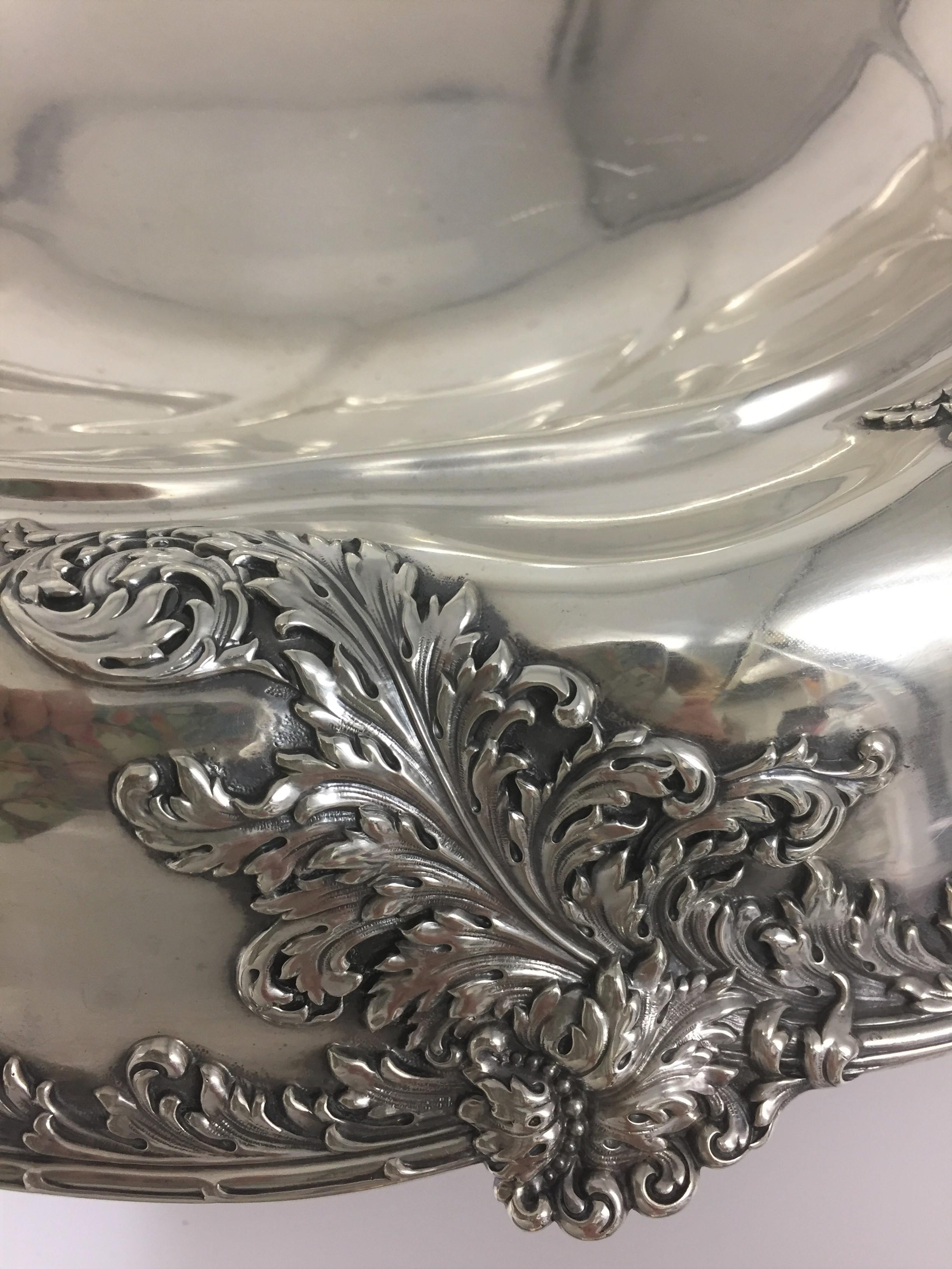 Extraordinary large American sterling silver center bowl, by Tiffany & Co., New York from 1895. Designed with ornate leaf pattern around parameter. Measuring 5 inches in height and 19.5 inches in diameter, large. Weighing 114 troy ounces. Bearing