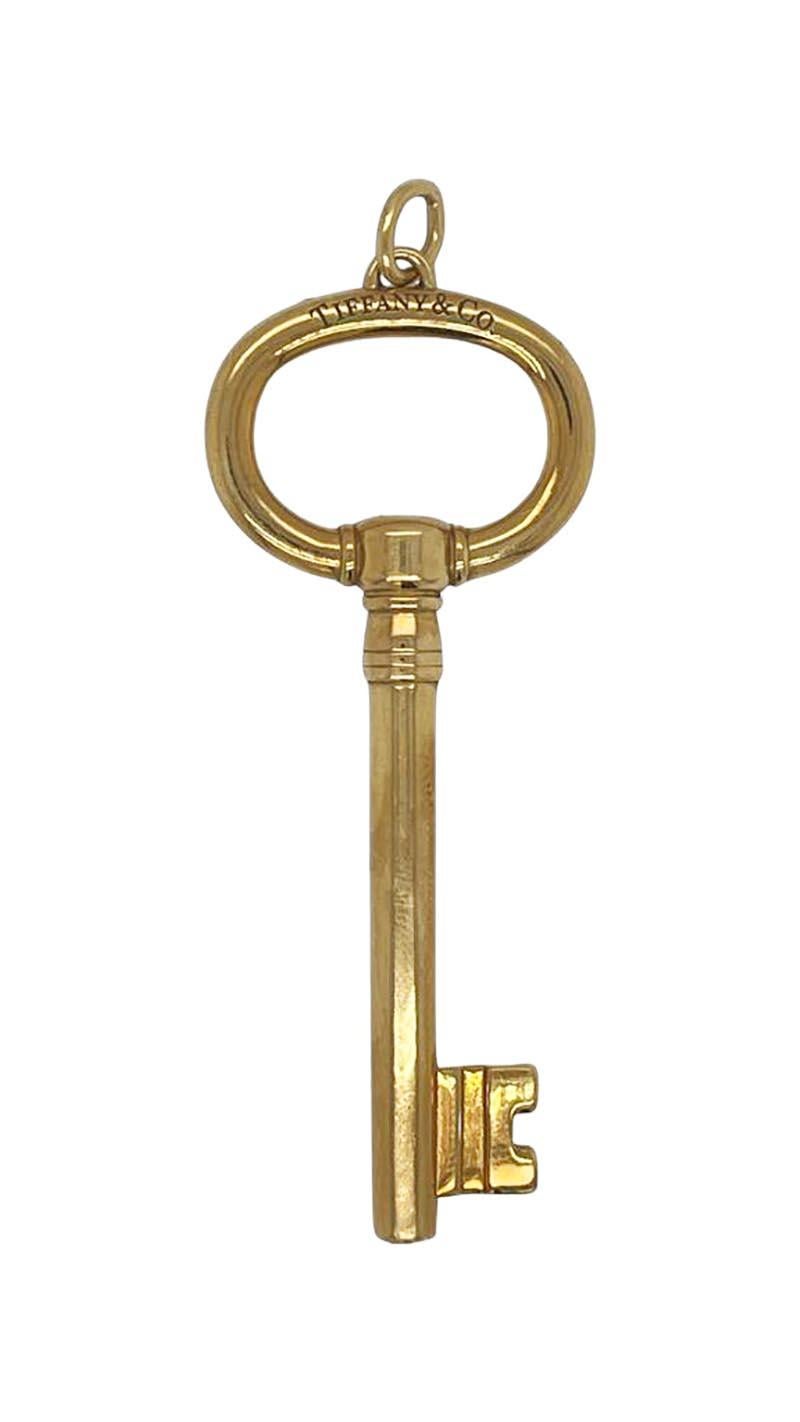 Large figural key pendant. Made and signed by TIFFANY & CO. 18K yellow gold. 2 1/2