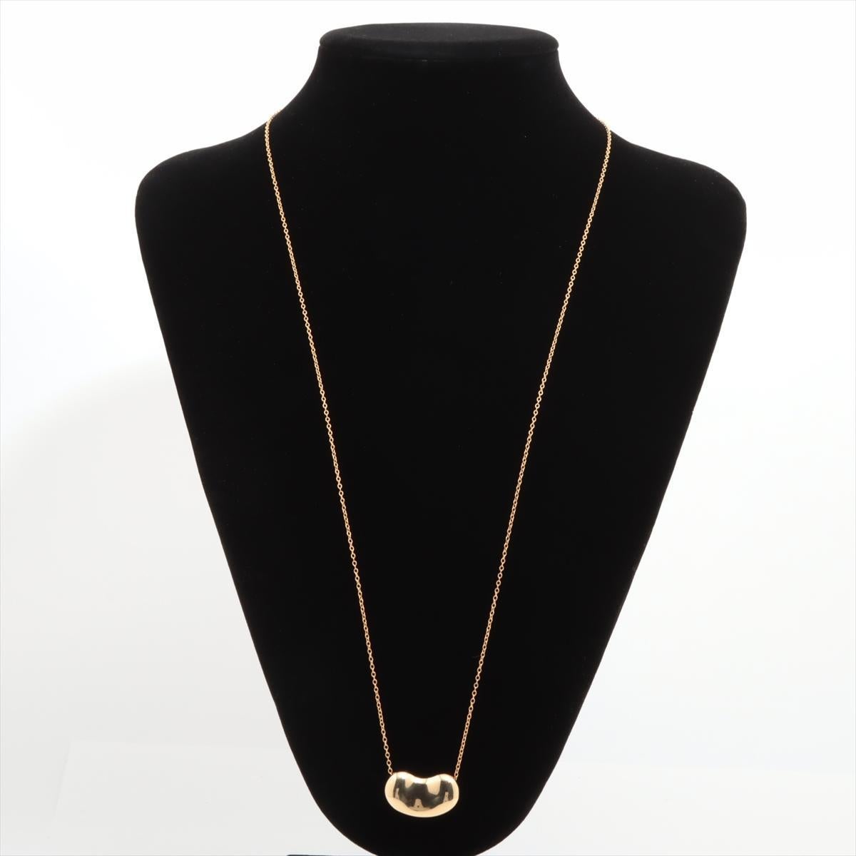 Lovely Find. PRE-OWNED 18kt Yellow Gold pendant with 18kt Yellow Gold Chain.
The piece is designed by Elsa Peretti and made by Tiffany & Co.

18k 750 Bean Pendant.

One of the largest beans available.
15mm by 27mm Bean

Long 32in in Length Chain
