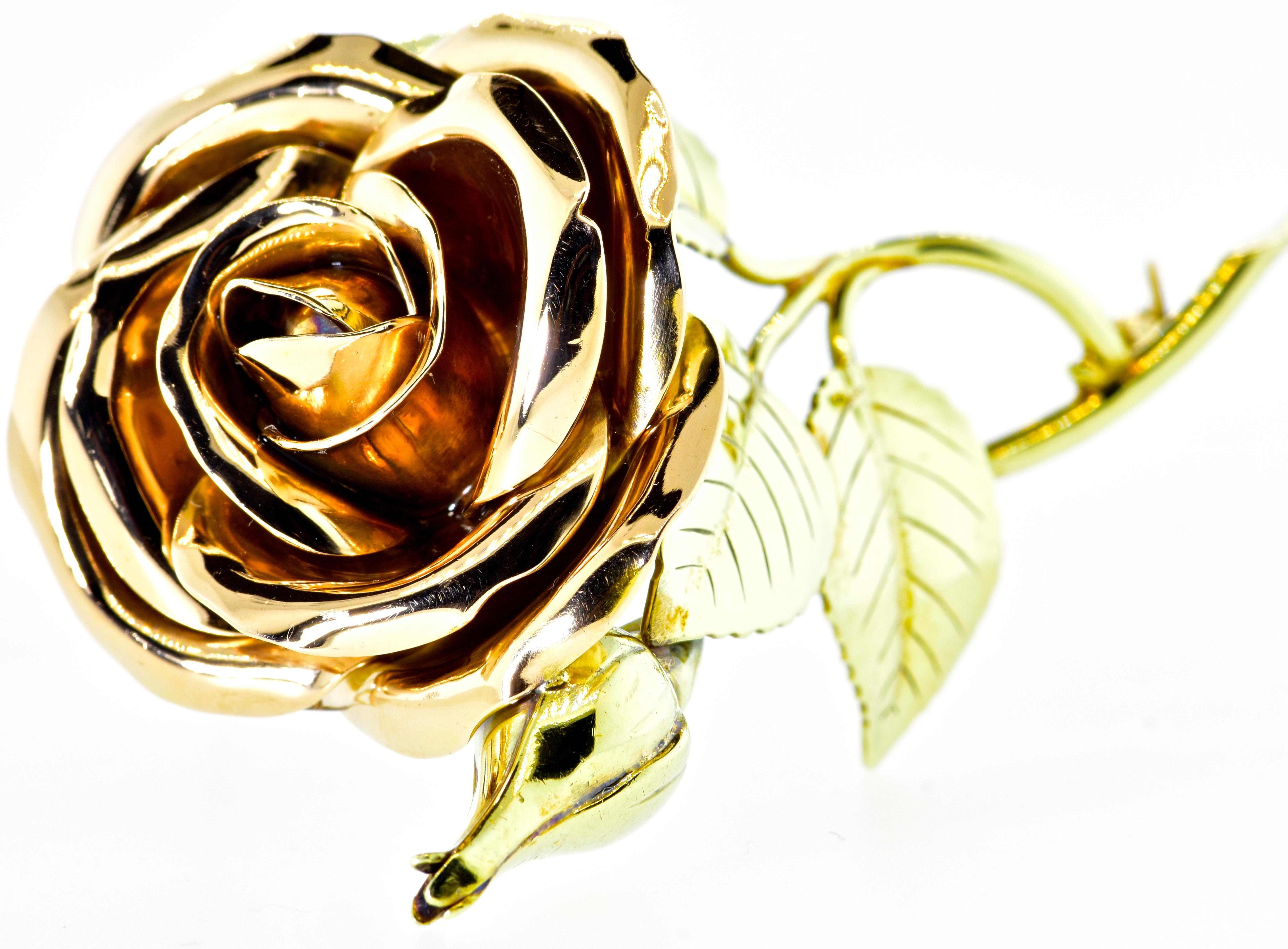 Tiffany & Co., has hand made a large robust rose in green and rose gold.  This double clip brooch is 2 5/8th inches in length, 24.7 dwt. In fine condition, this striking piece is signed on the verso Tiffany & Co.,  circa 1950.