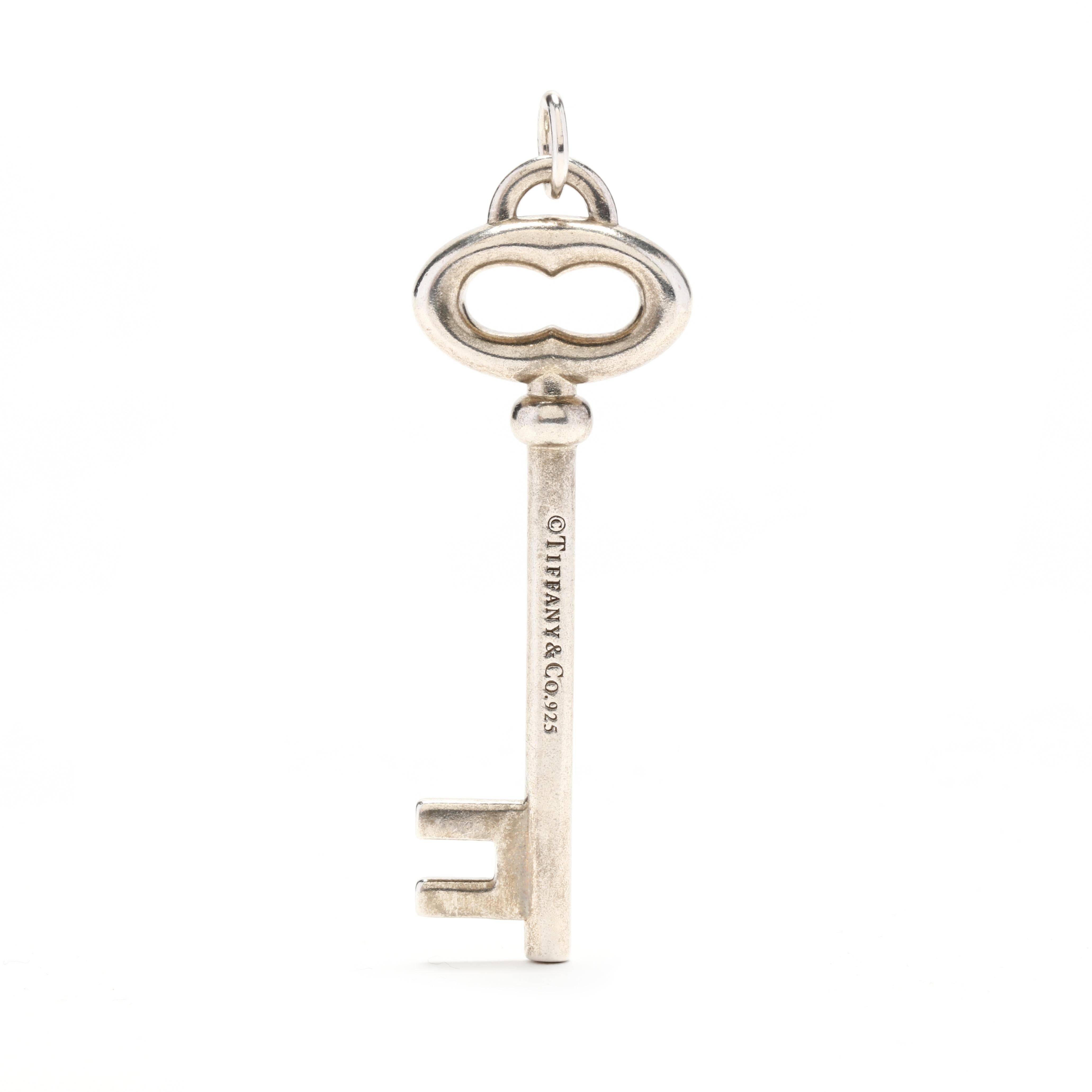 A Tiffany & Company sterling silver key large key pendant. This charm features a simple key motif with an oval jump ring.



Length: 2.25 in.



Width: 11/16 in.



Weight: 9.2 grams
