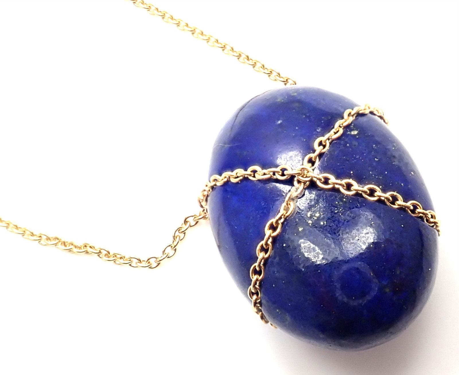 18k Yellow Gold Large Lapis Lazuli Crossover Pendant Necklace by Tiffany & Co. 
With 1 Lapis 22mm x 15mm x 11mm
This necklace is in mint condition and comes with Tiffany & Co blue box.
Details: 
Chain Length: 15