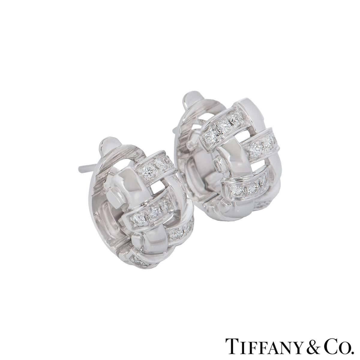 An shimmery pair of 18k white gold Tiffany & Co. lattice earrings. Each earring compromises of 12 round brilliant cut diamonds with a total weight of 0.48ct, predominantly F-G in colour and VS+ clarity. The earrings feature a post with a