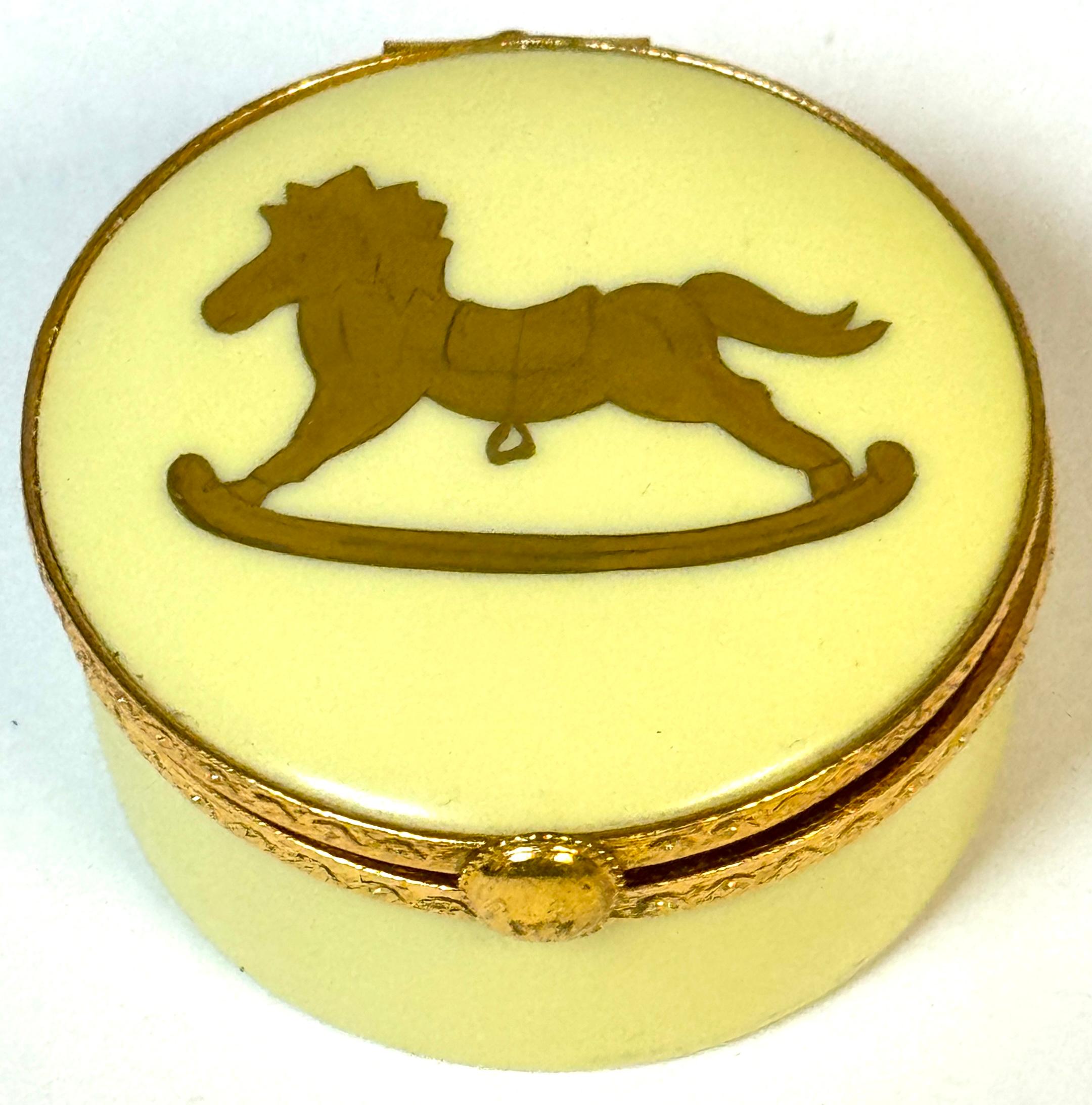 Tiffany & Co. Le Tallec Limoges Rocking Horse Motif Gilt Bronze Hinged Box 
France, Later 20th Century 

A charming Tiffany & Co. Le Tallec Limoges gilt bronze hinged box, featuring a delightful rocking horse motif. This diminutive circular box,