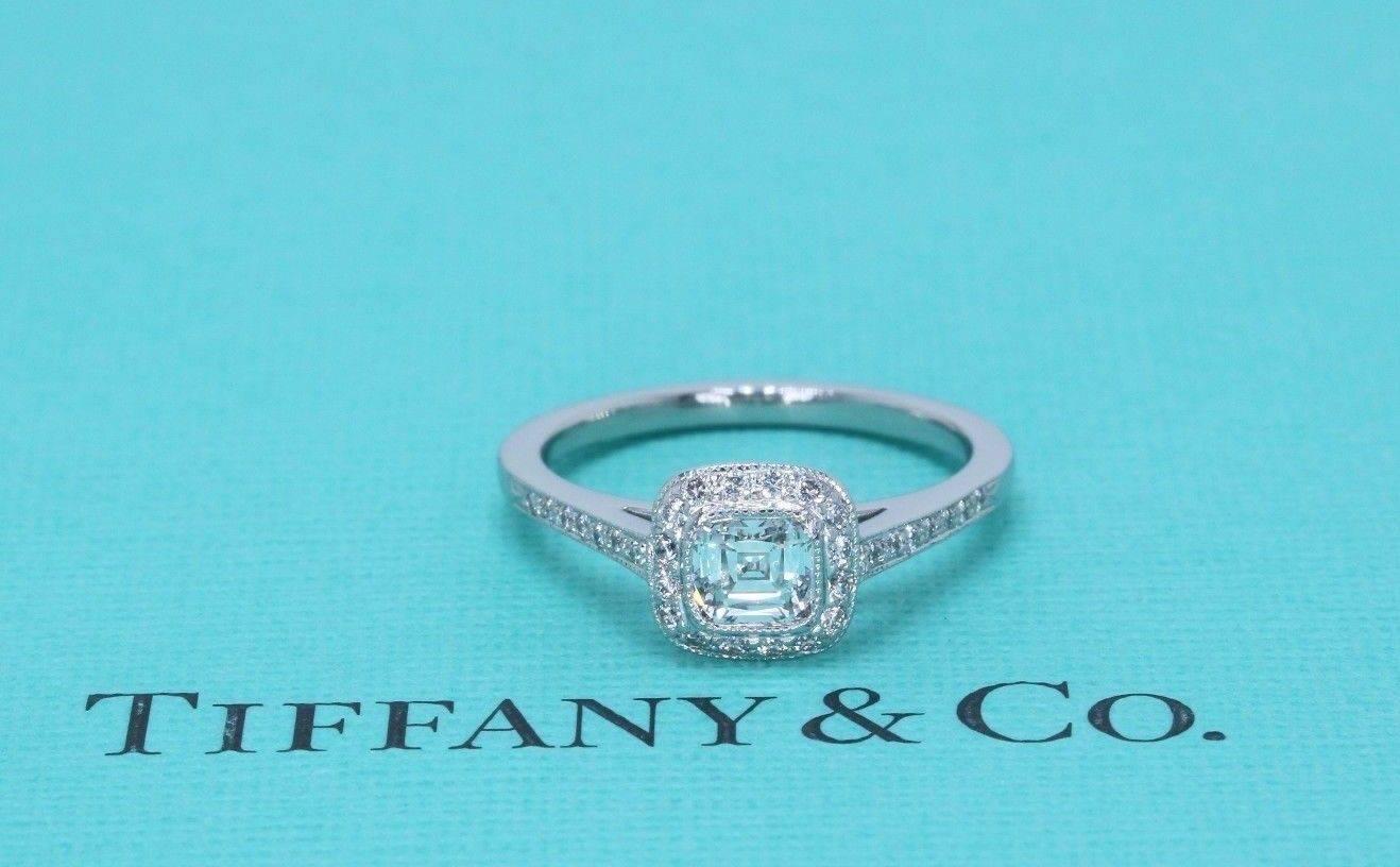 Tiffany & Co Legacy Engagement Ring
Style: Cushion Diamond surrounded by bead set diamonds
Serial Number: 31025605/O1150332
Metal:  Platinum
Size: 5.5
Total Carat Weight:  0.66TCW
Main Diamond Shape: Cushion Modified Brilliant
Diamond Color &