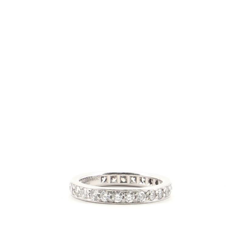 Condition: Good. Shows signs of heavy wear. 
Accessories: No Accessories 
Measurements: Size: 8 - 57, Width: 3.3 mm
Designer: Tiffany & Co.
Model: Legacy Band Ring Platinum and Diamonds Wide
Exterior Material: Diamond, Platinum 
Exterior Color: