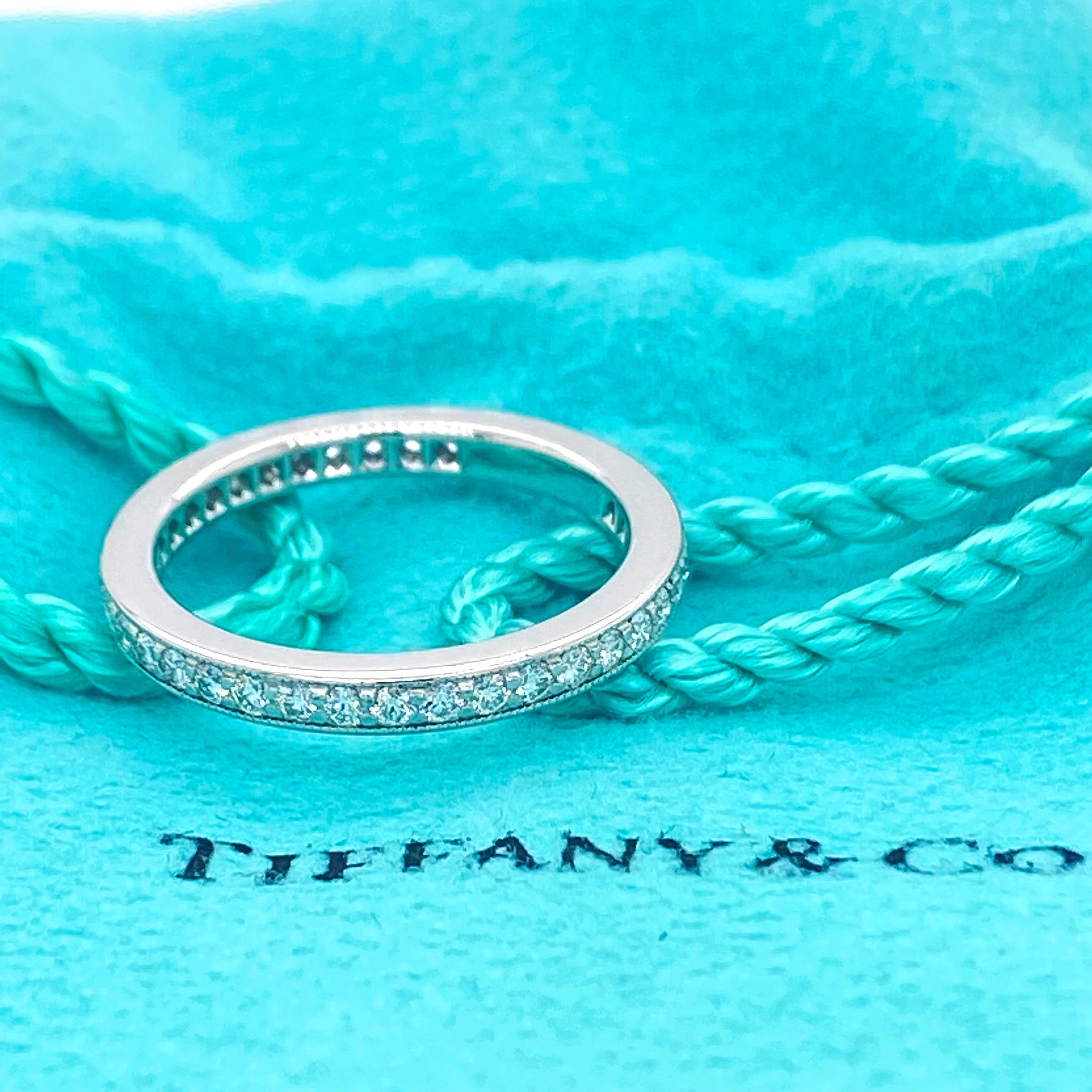 Tiffany & Co Legacy Collection Full Circle Band Ring
Style:  Full-Circle Bead-Set with Milgrain Edge
Metal:   Platinum PT950
Size: 5
Measurements:  2 MM Width
TCW:  0.43 tcw
Main Diamond:  Round Brilliant Diamonds
Color & Clarity:  G, VVS
Hallmark: 
