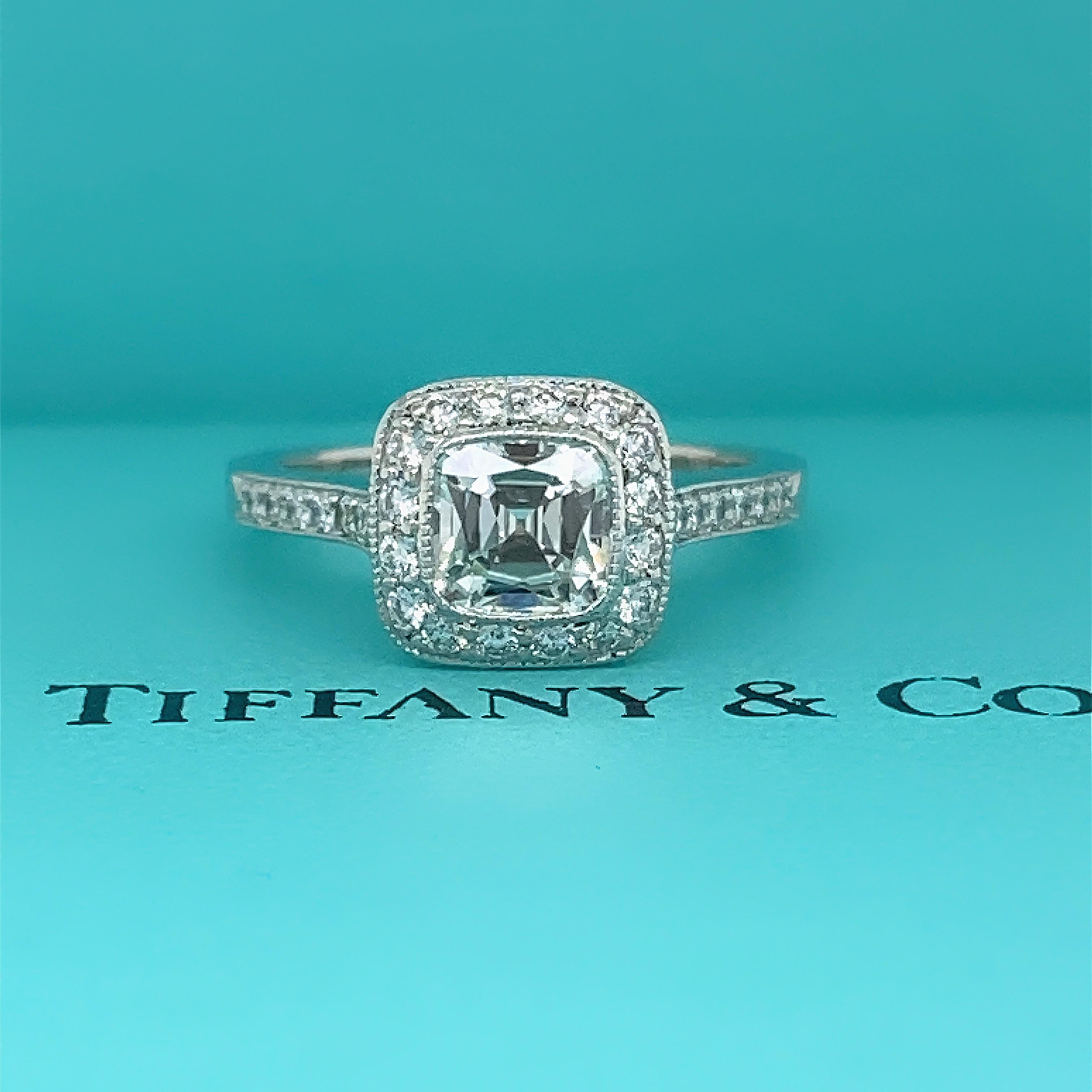 Tiffany & Co. LEGACY Cushion Diamond Engagement Ring
Style:  Halo
Ref. number:  24971589/J10100317
Metal:   Platinum PT950
Size:  6
TCW:  1.33 tcw
Main Diamond:  Cushion Modified Brilliant Diamond 1.00 cts
Color & Clarity:  I, VS2
Diamonds