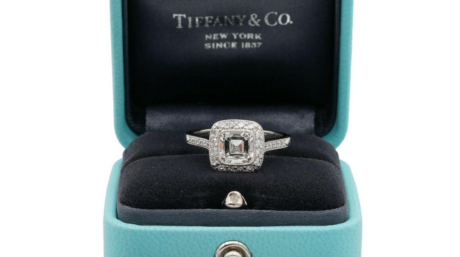 Tiffany & Co Cushion Brilliant Engagement Ring from the “Legacy” collection featuring a 1.50carat center, G color, VS1 clarity, finely crafted in Platinum featuring 42 dazzling bead-set diamonds in a full bezel millgrain design halo and half-way