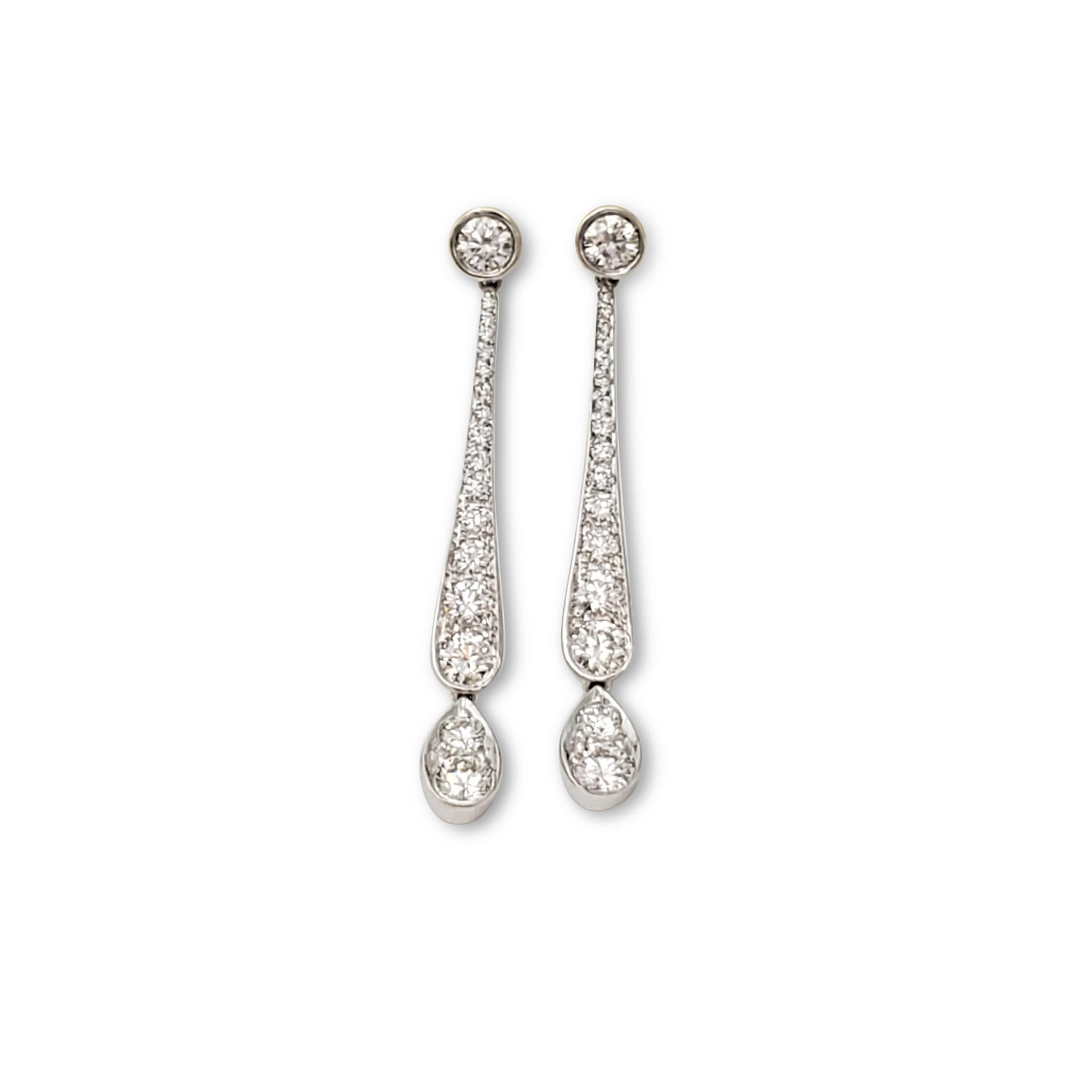 Authentic Tiffany & Co. swing drop earrings from the 'Legacy' collection crafted in platinum and set with an estimated 0.56 carats of round brilliant cut diamonds (E-F color, VS clarity). Signed T&Co., PT950. The earrings are presented with the