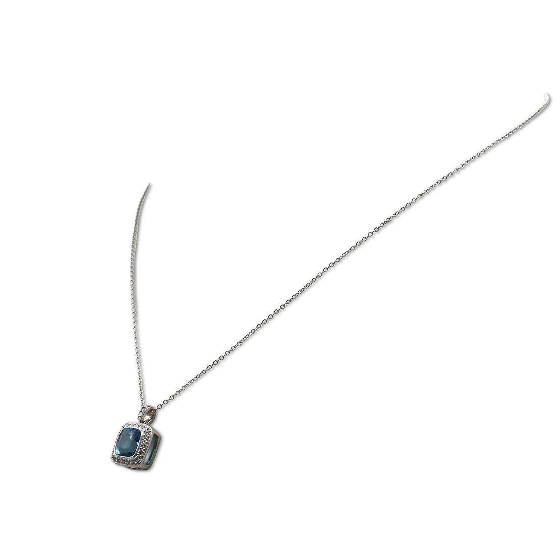 Authentic Tiffany & Co. 'Legacy' pendant necklace crafted in platinum centering on a cushion-cut aquamarine stone weighing an estimated 2.00 carats. The vibrant aquamarine stone is surrounded by high-quality round brilliant cut diamonds (E-F, VS