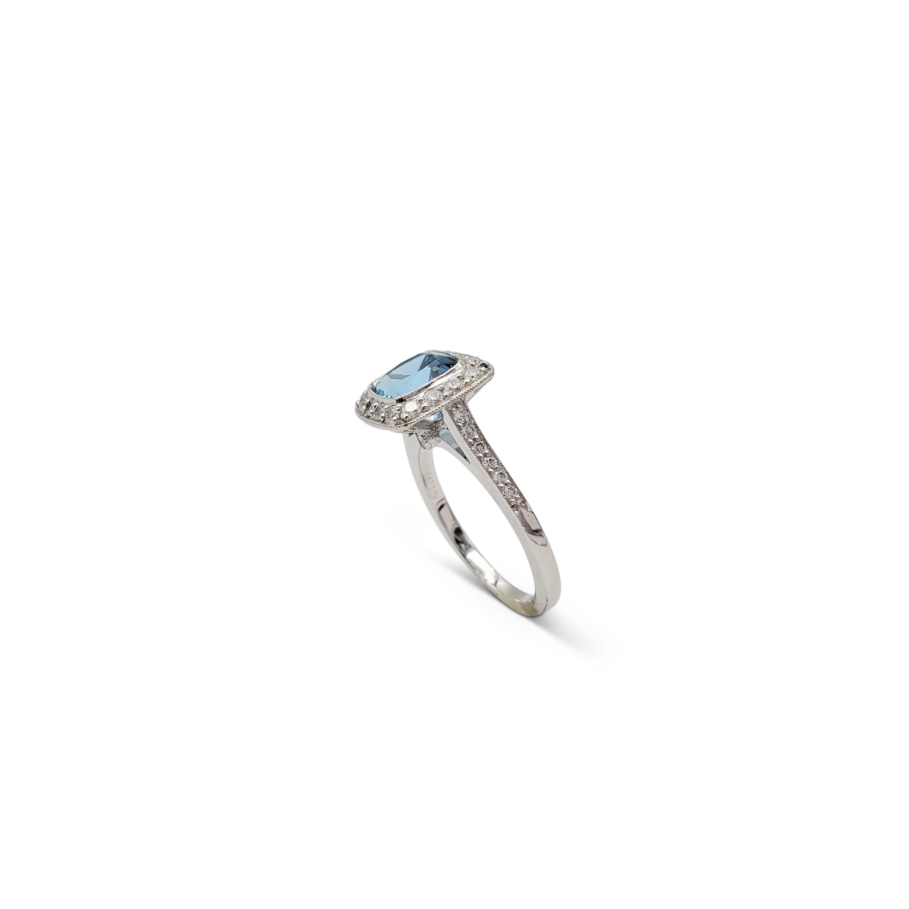 Authentic Tiffany & Co. 'Legacy' ring crafted in platinum centering on a cushion-cut aquamarine stone weighing an estimated 1.50 carats. The lively aquamarine stone is surrounded by high-quality round brilliant cut diamonds (E-F color, VS clarity)
