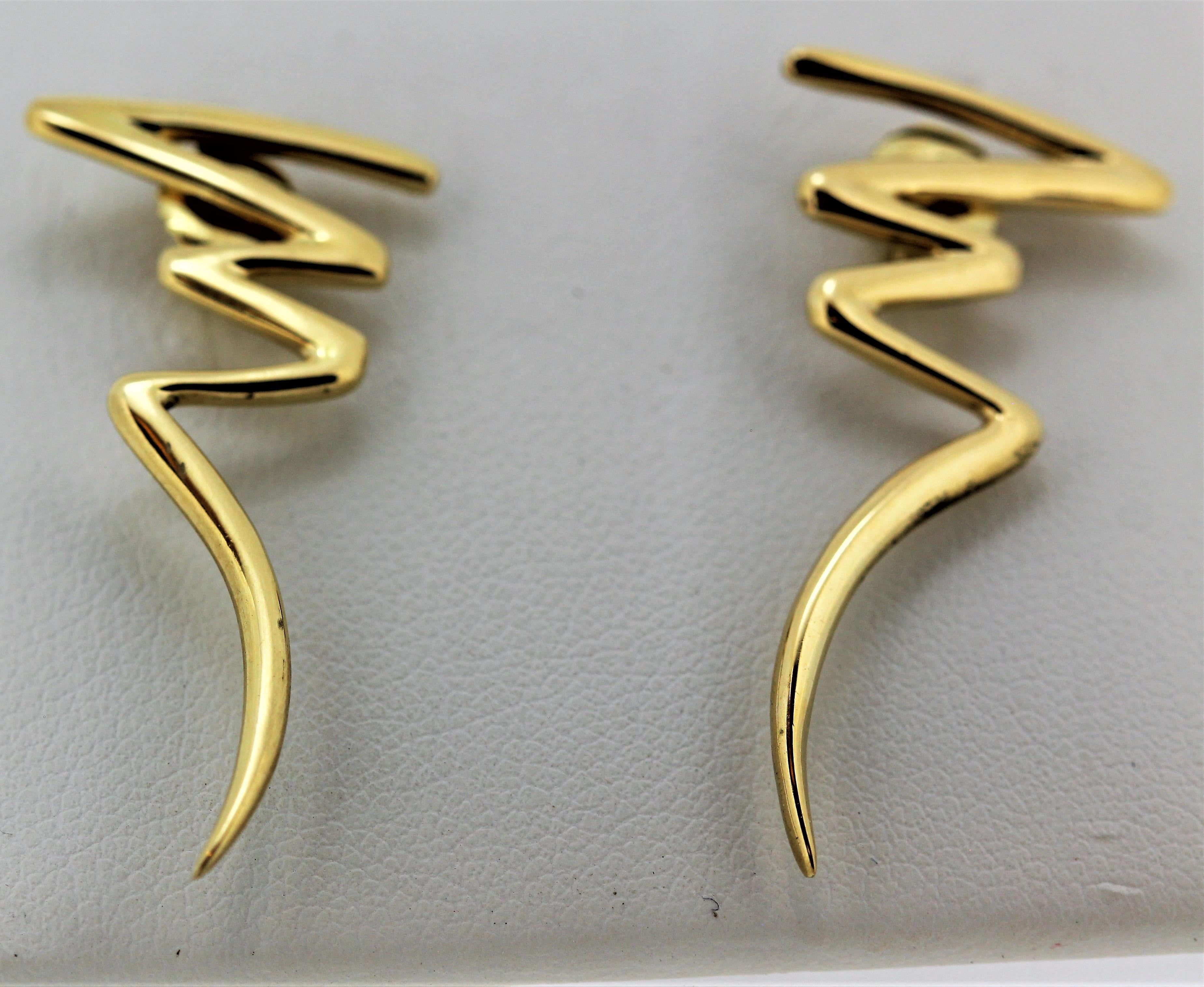 Tiffany Lighting Bolt by Paloma Picasso Earrings, Circa 1983.
Measurements: 35 long x 16 wide mm
Made in 18 karat yellow gold.
Stamped and hallmarked.
Weight 5 grams
Note:  The earrings have not been published, but will be happy to do them for you.
