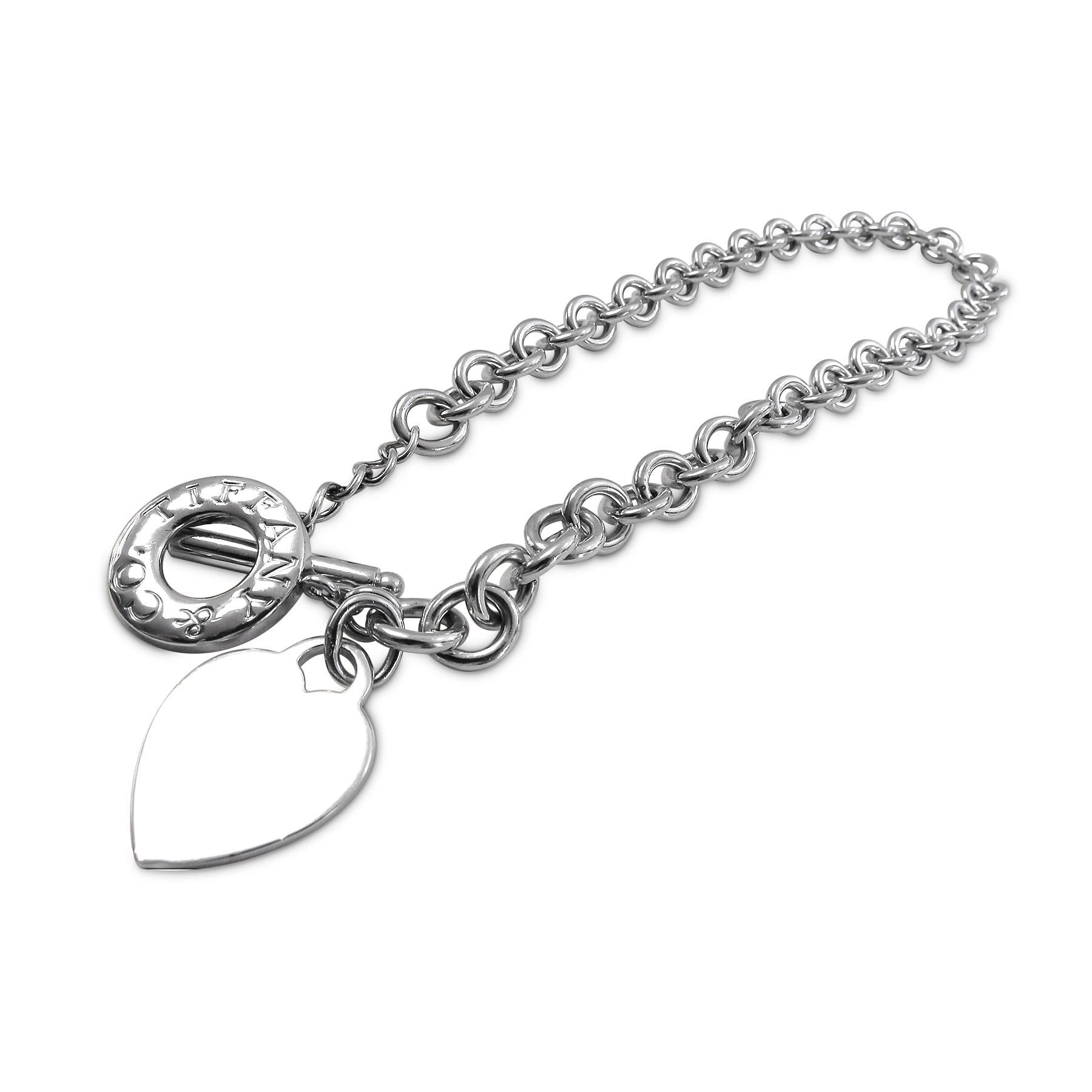 This classic Tiffany and co necklace will steal your heart with its design. Crafted in Sterling silver, its design showcases a glorious link heart tag necklace Choker with a toggle clasp. It is 15 inches long, weighs 74.6 grams and the link is 2mm
