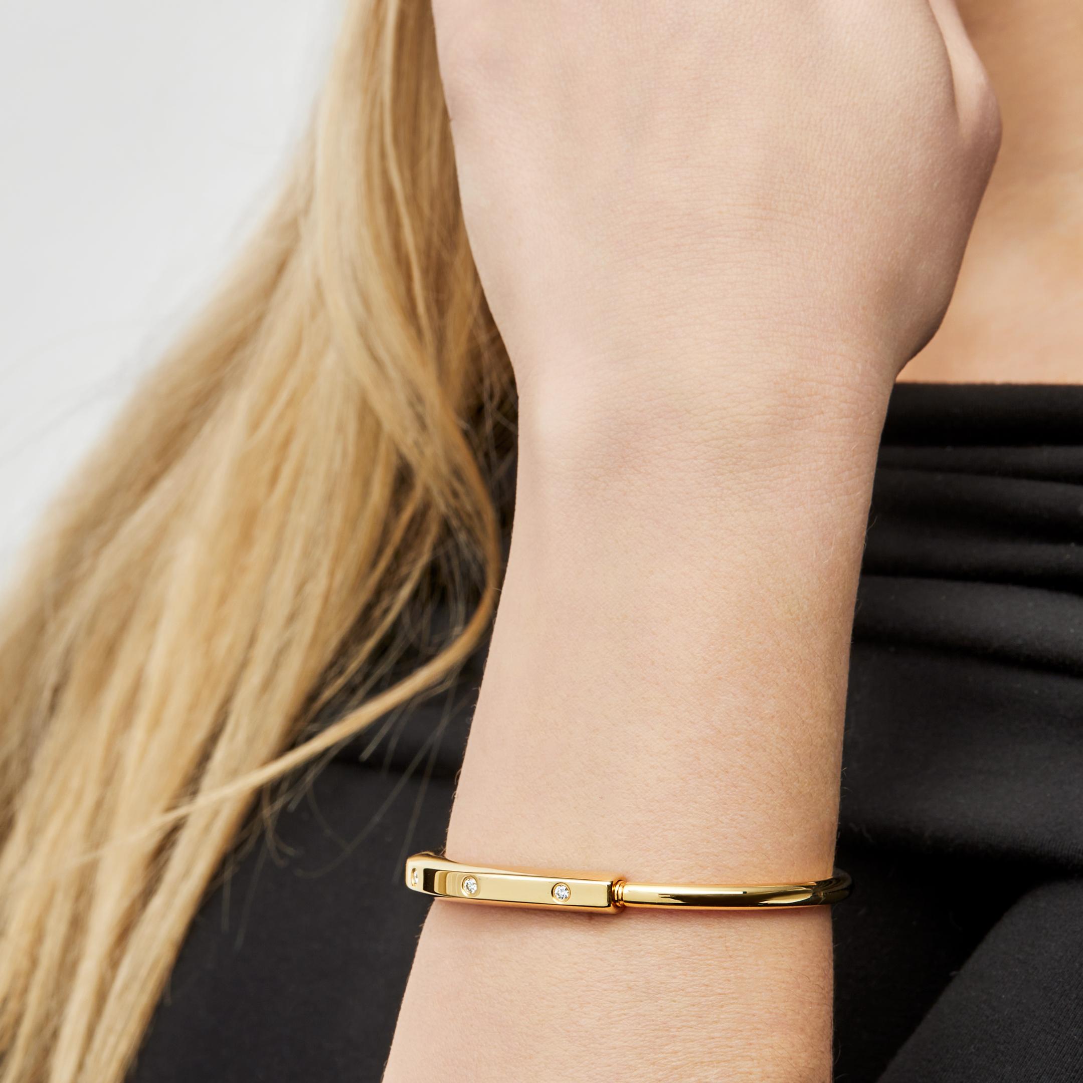 Designed to be worn by all genders, The Tiffany & Co Lock Bangle is a bold visual statement about the personal bonds. 

Crafted in 18-karat yellow gold, the Tiffany Lock bangle features an innovative clasp a nod to Tiffany's history. Carefully