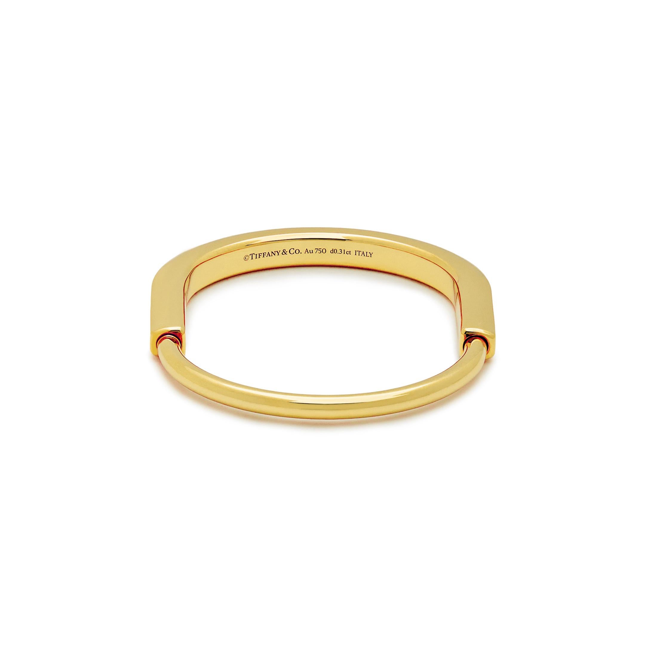 Round Cut Tiffany & Co. Lock Bangle in Yellow Gold with Diamond Accents For Sale