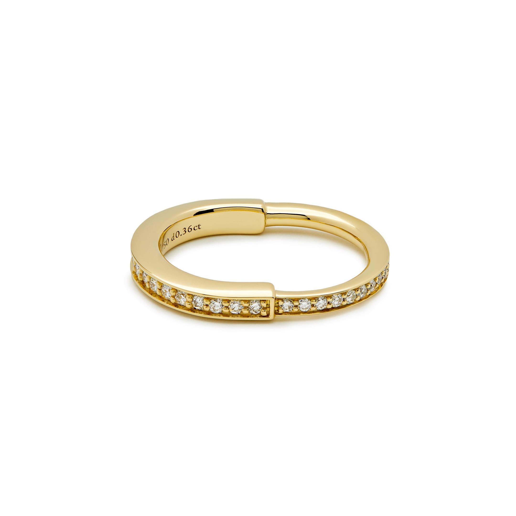 The Tiffany & Co. Lock ring is a bold symbol of unity and diversity, celebrating personal connections that shape us. Crafted in 18-karat yellow gold with round brilliant, this ring is a stylish choice whether worn alone or as part of your everyday