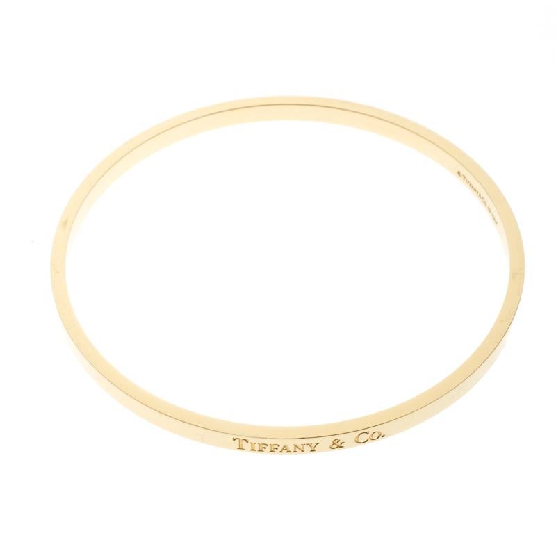 Tiffany & Co. 18 Karat Gelbgold schmales Logo-Armreif Damen
