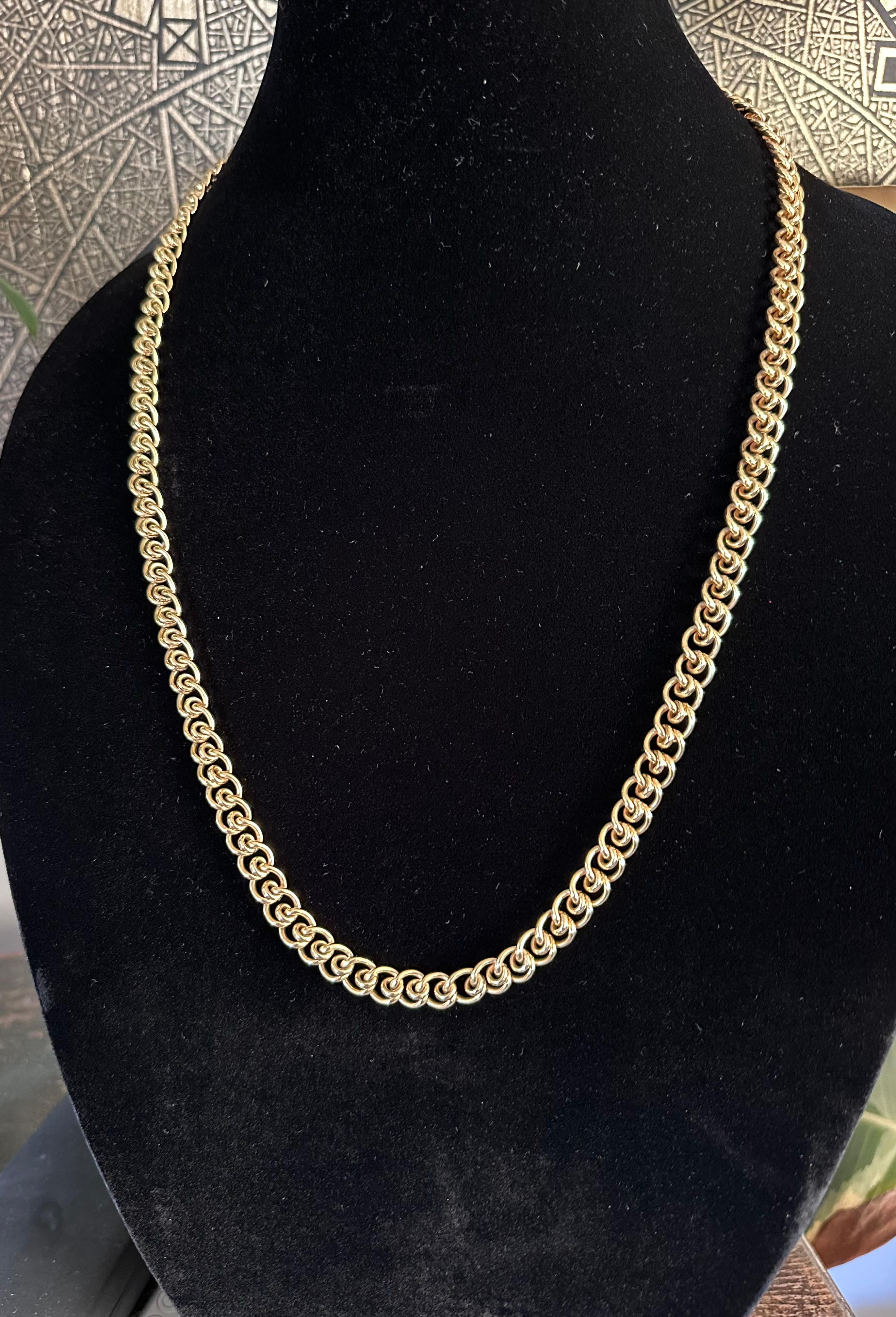Tiffany & Co  1970's
31 Inch Long Intricate Link Necklace 
18 karat yellow gold necklace.
Weight  3.25 OZ 0r ( 100 g) 
Circa 1970 
Signed Tiffany & Co and Tiffany scratch inventory numbers. 
Nice Long Chain,  Well Cared for,  Excellent Condition and