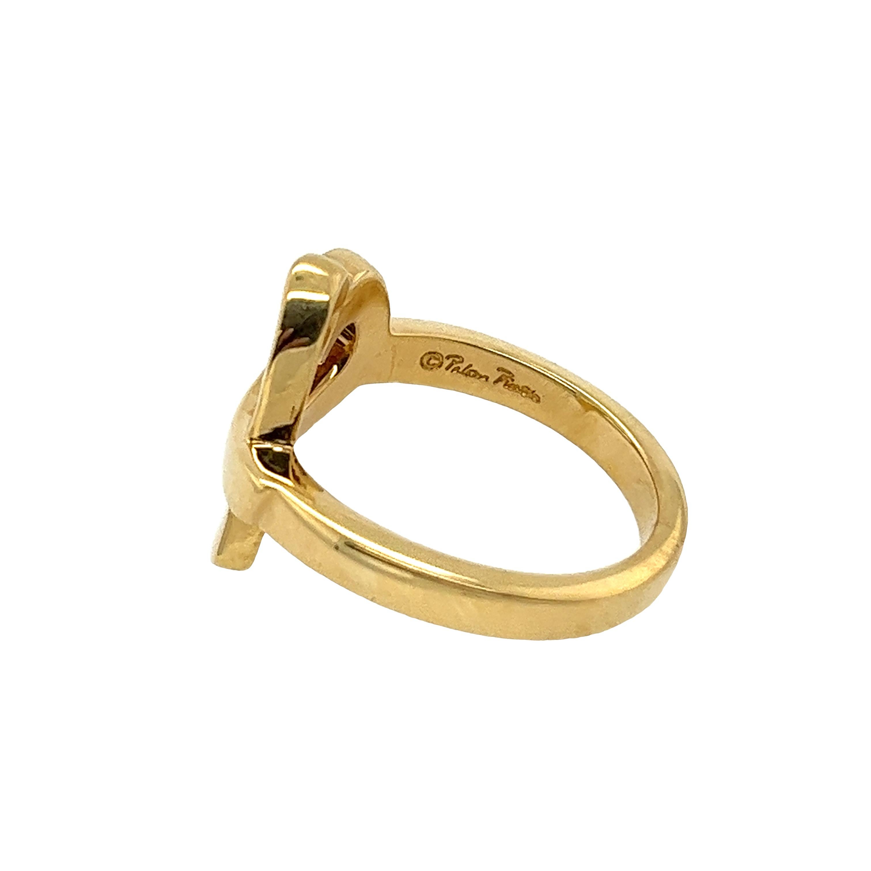Elevate your jewelry collection with this exquisite Tiffany & Co Love Heart Ring by Paloma Picasso. Crafted in 18ct yellow gold, this stunning ring features a delicate love heart design that exudes elegance and romance.

•	Width of Band: 2.6mm