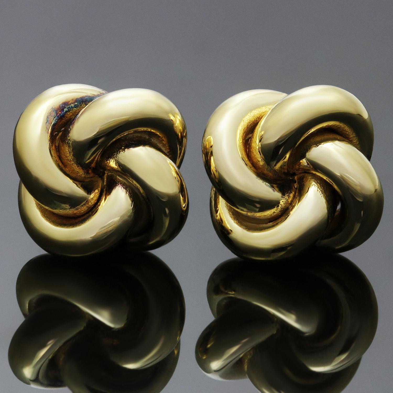 These classic Tiffany Love Knot earrings feature 4 intertwined loops crafted in 14k yellow. Made in United States circa 2000s. Measurements: 0.38