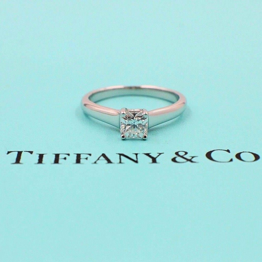 Tiffany & Co.
Style:  Lucida
Serial Number:   21924156 / H05040579
Metal:  Platinum PT950
Size:  5.5 - sizable  
Total Carat Weight:  0.46 cts
Diamond Shape:  Cut Corner Square Modified Brilliant
Diamond Color & Clarity:  E / VVS1
Hallmark:  Pat