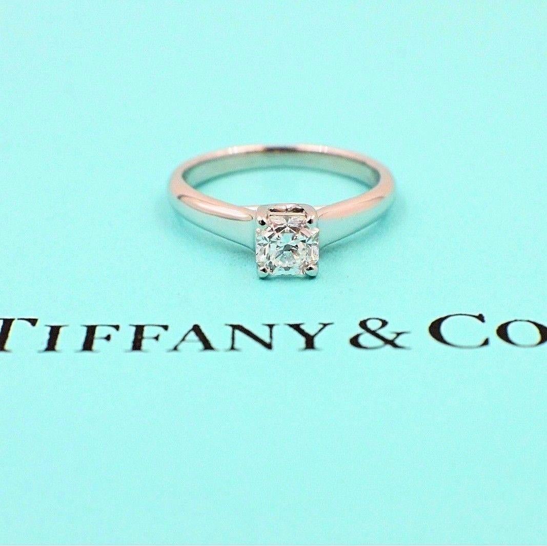 Tiffany & Co.
Style:  Lucida Solitaire
Serial Number:  18769786 / F02050412
Metal:  Platinum PT950
Size:  5 - sizable  
Total Carat Weight:  0.53 CTS
Diamond Shape:  Lucida - Cut Cornered Square Mix Cut
Diamond Color & Clarity:  F / VVS2
Hallmark:  